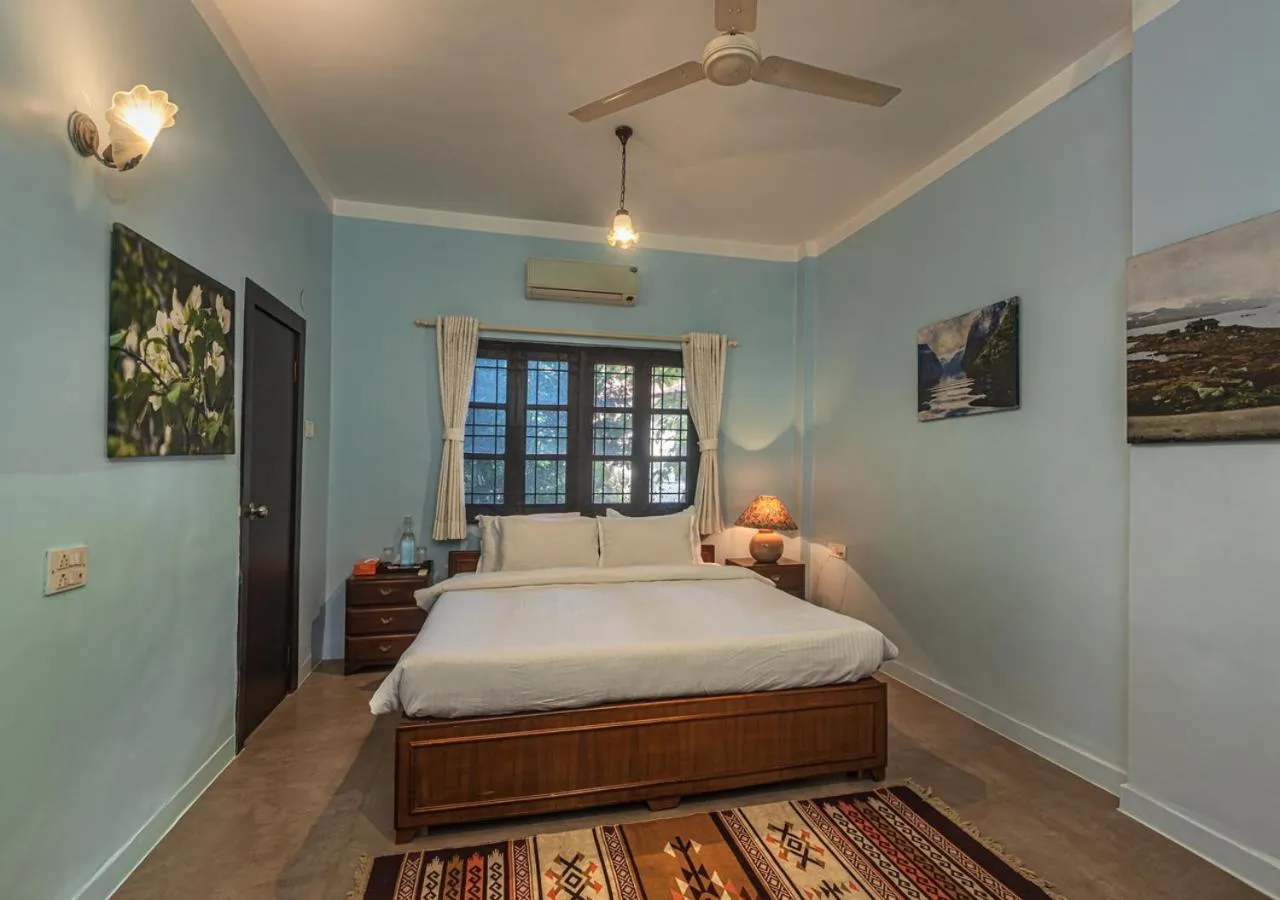 Bed in SaffronStays Oriana, Alibaug