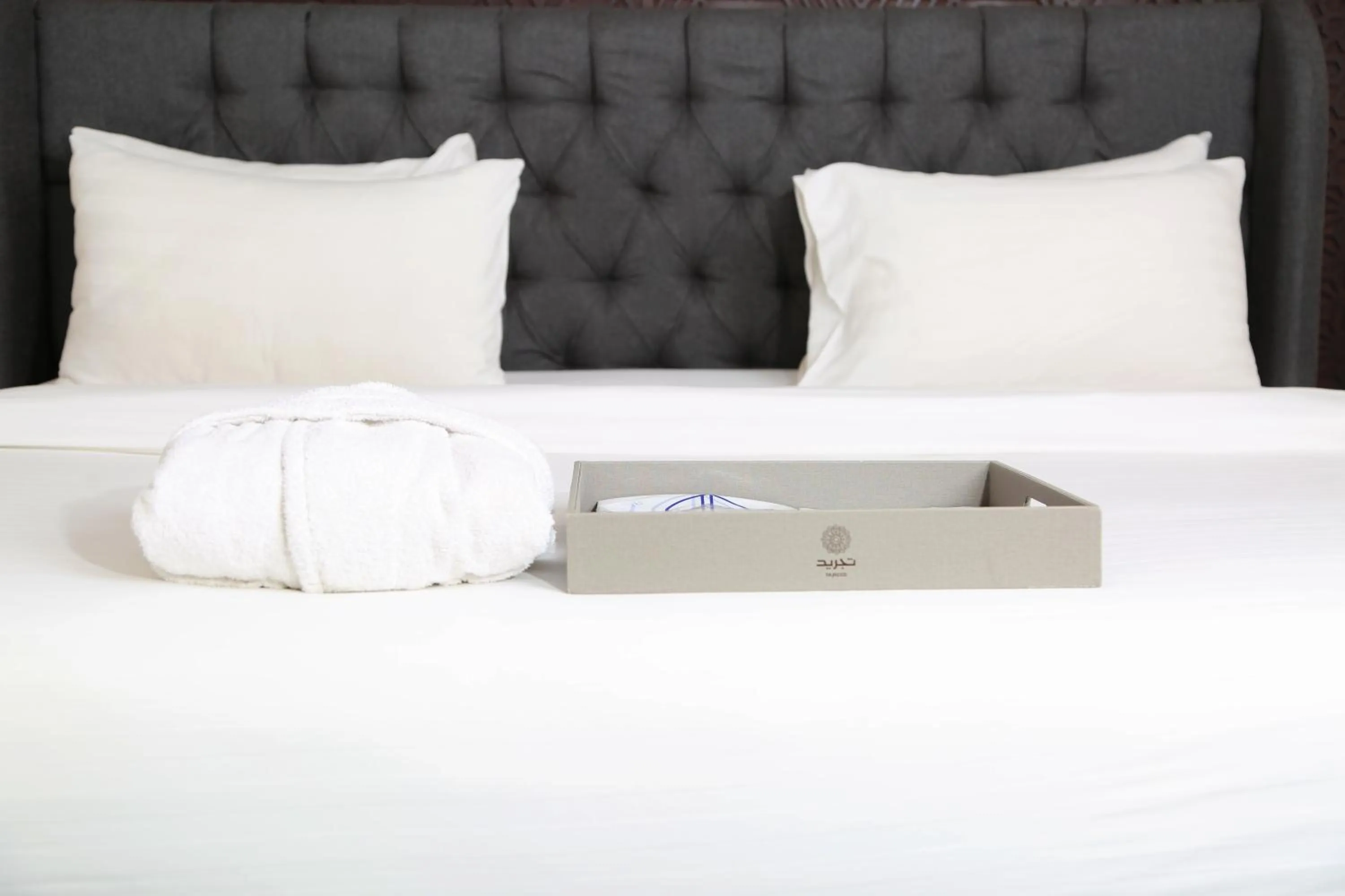 Bed in Tajreed Suites