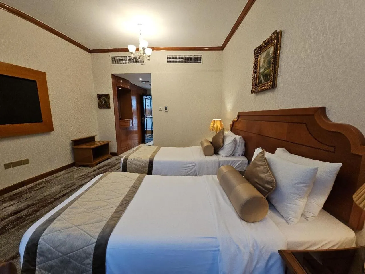 Bed in Royal Concorde Hotel & Suite