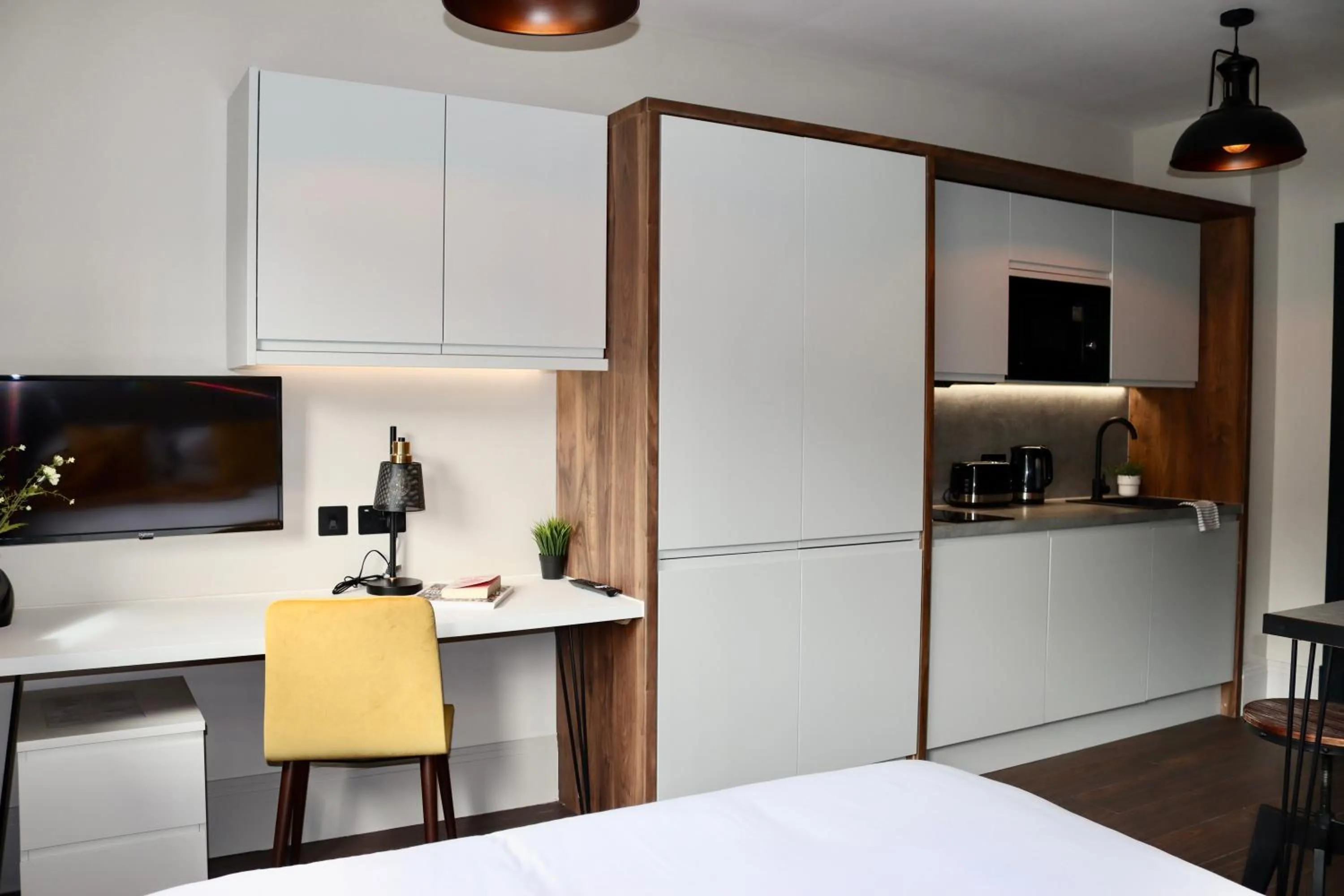 Kitchen or kitchenette, Bed in Vive Hotel