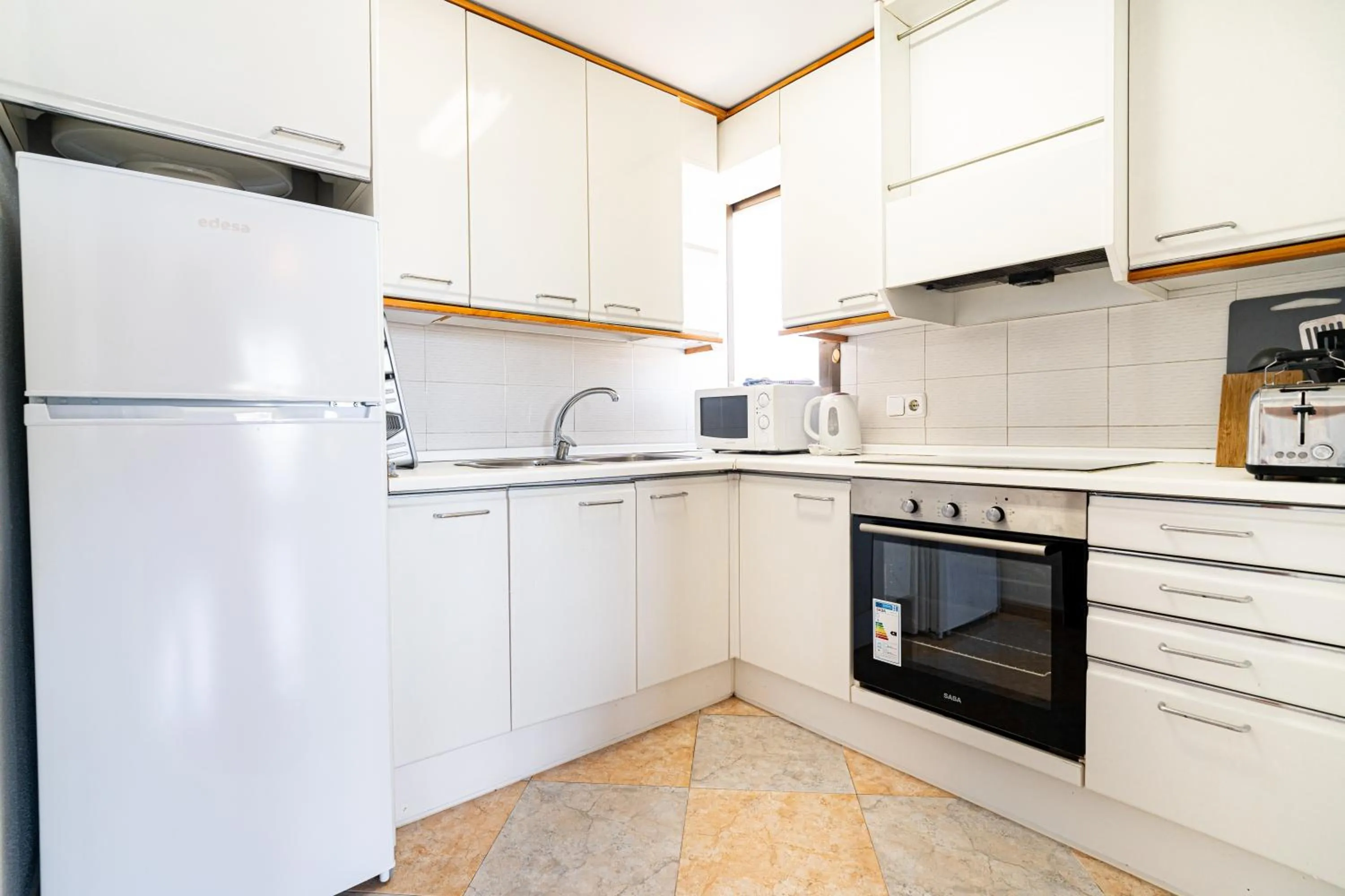 kitchen in Las Palomas Apartments Econotels