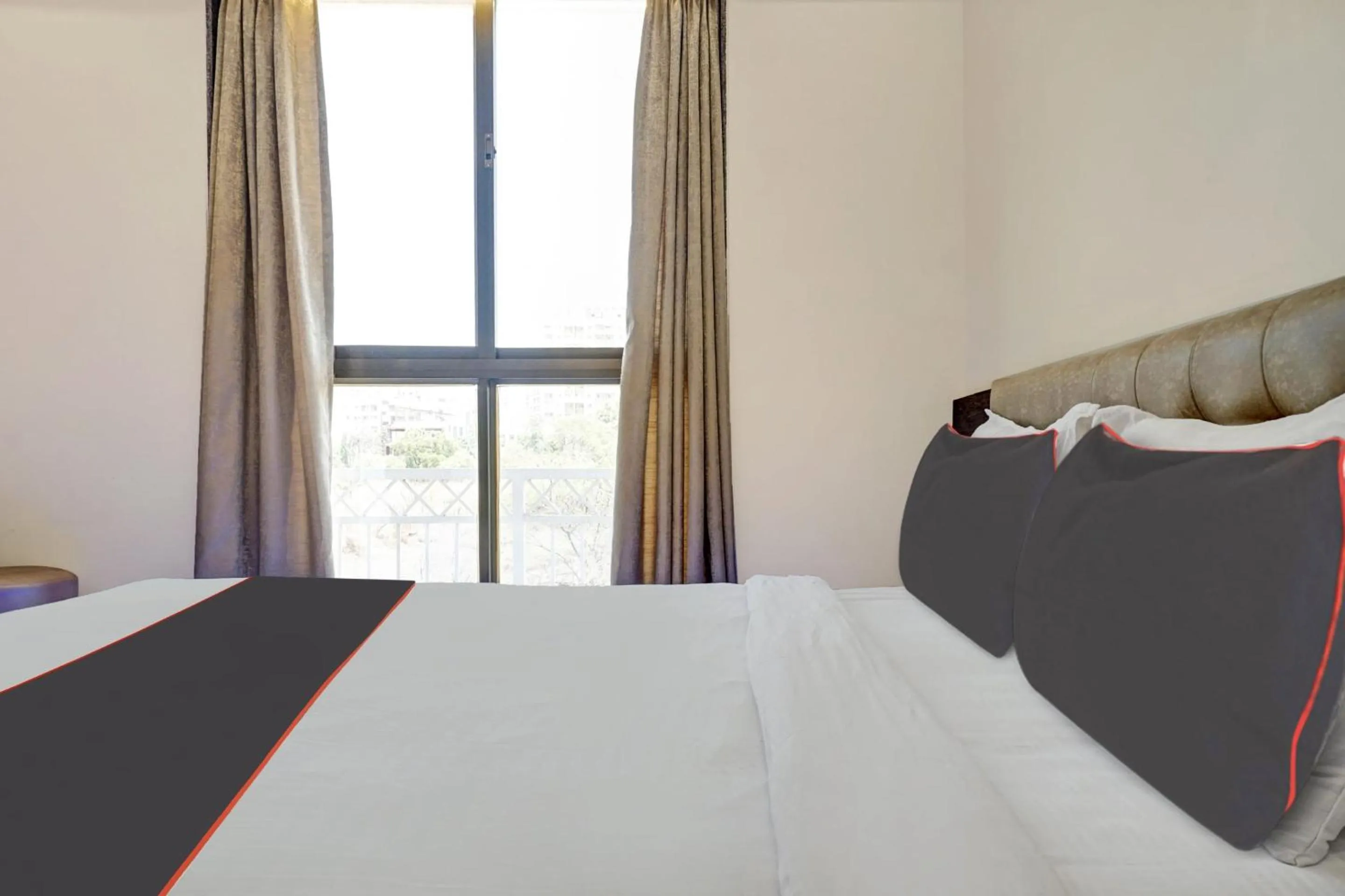 Bedroom, Bed in Super Townhouse Poona Royal