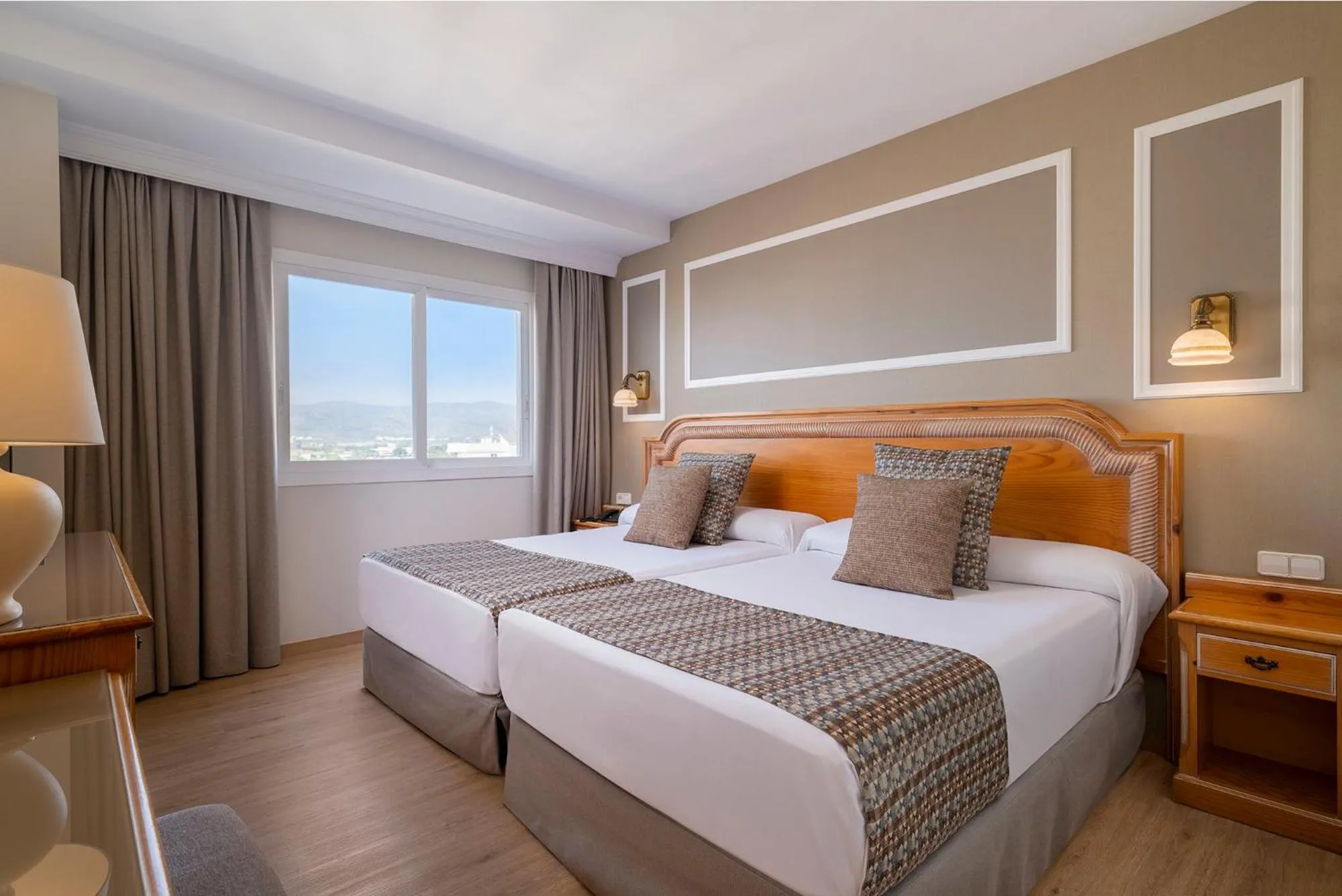Bed in Peñiscola Plaza Suites