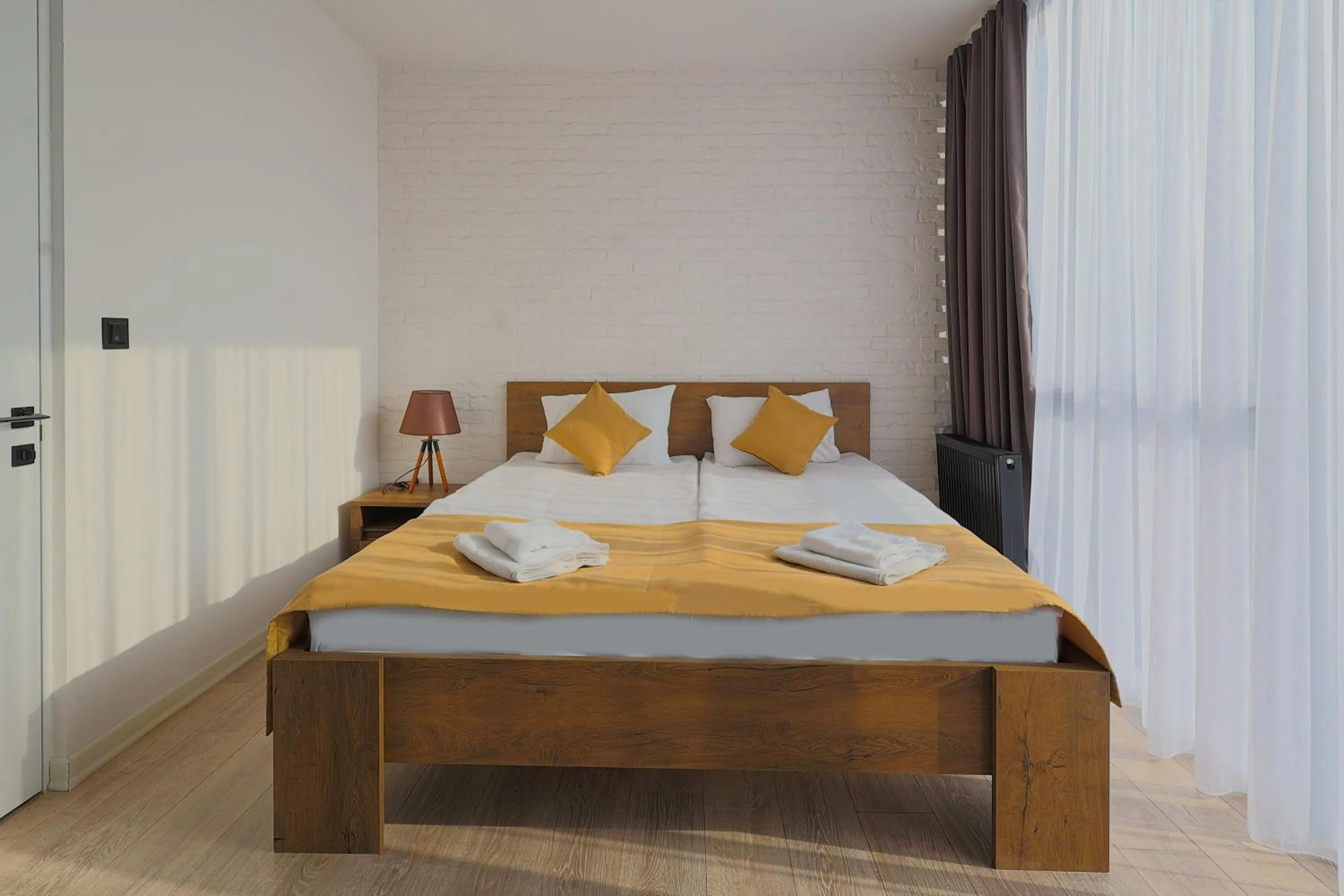Bed in Welcome Republic Square Apartments