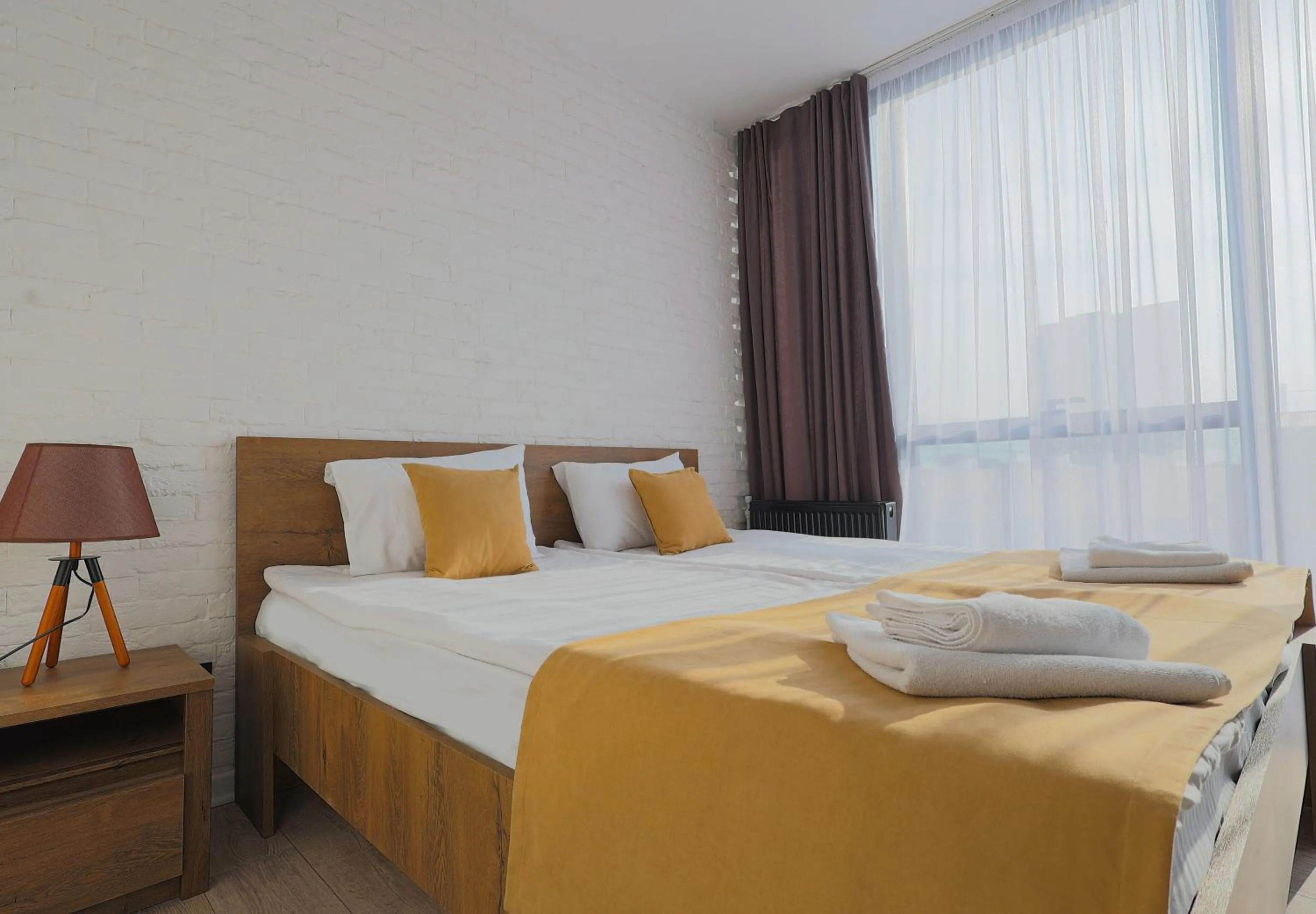 Bed in Welcome Republic Square Apartments