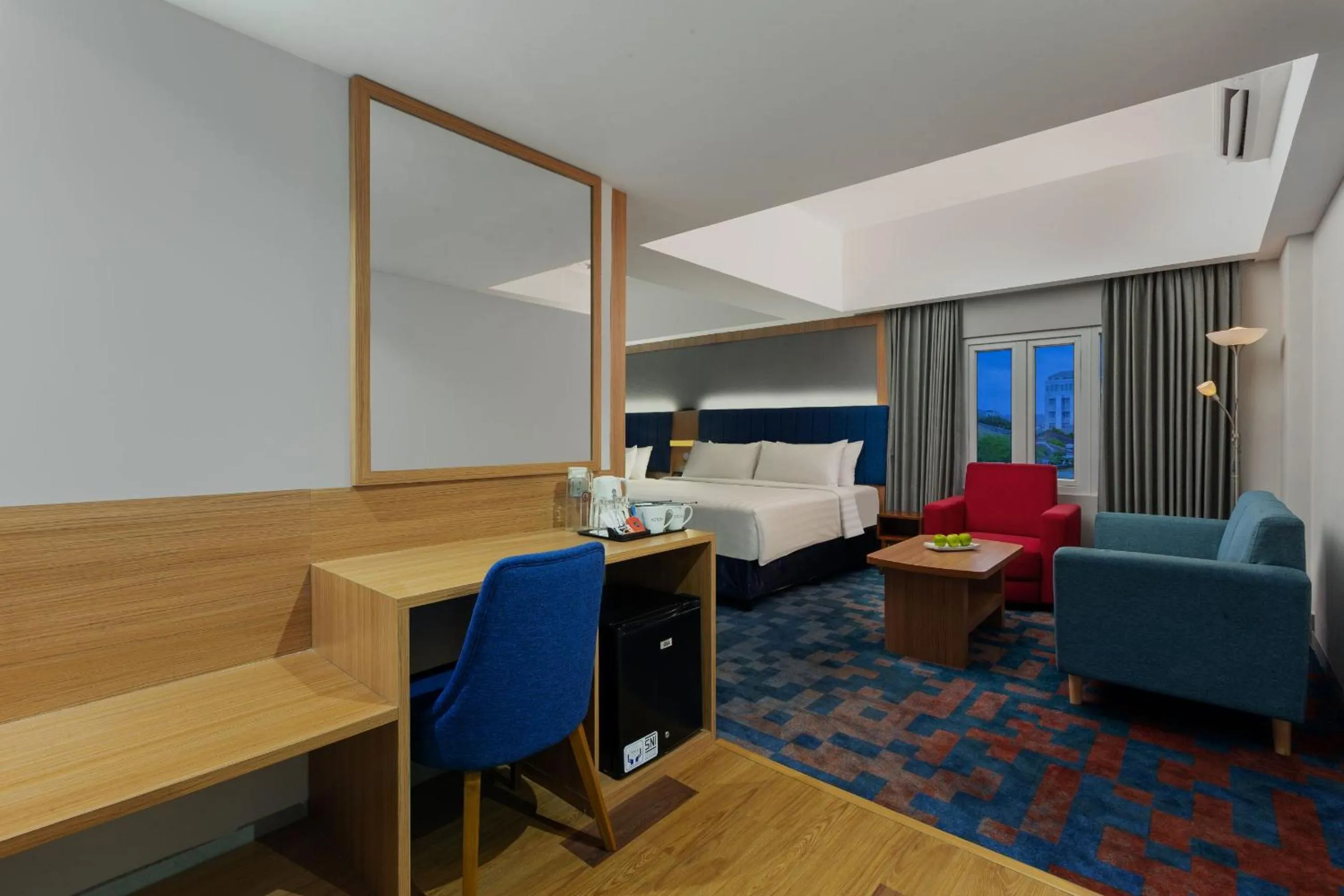 Seating area, Bed in Aston Inn Cilacap