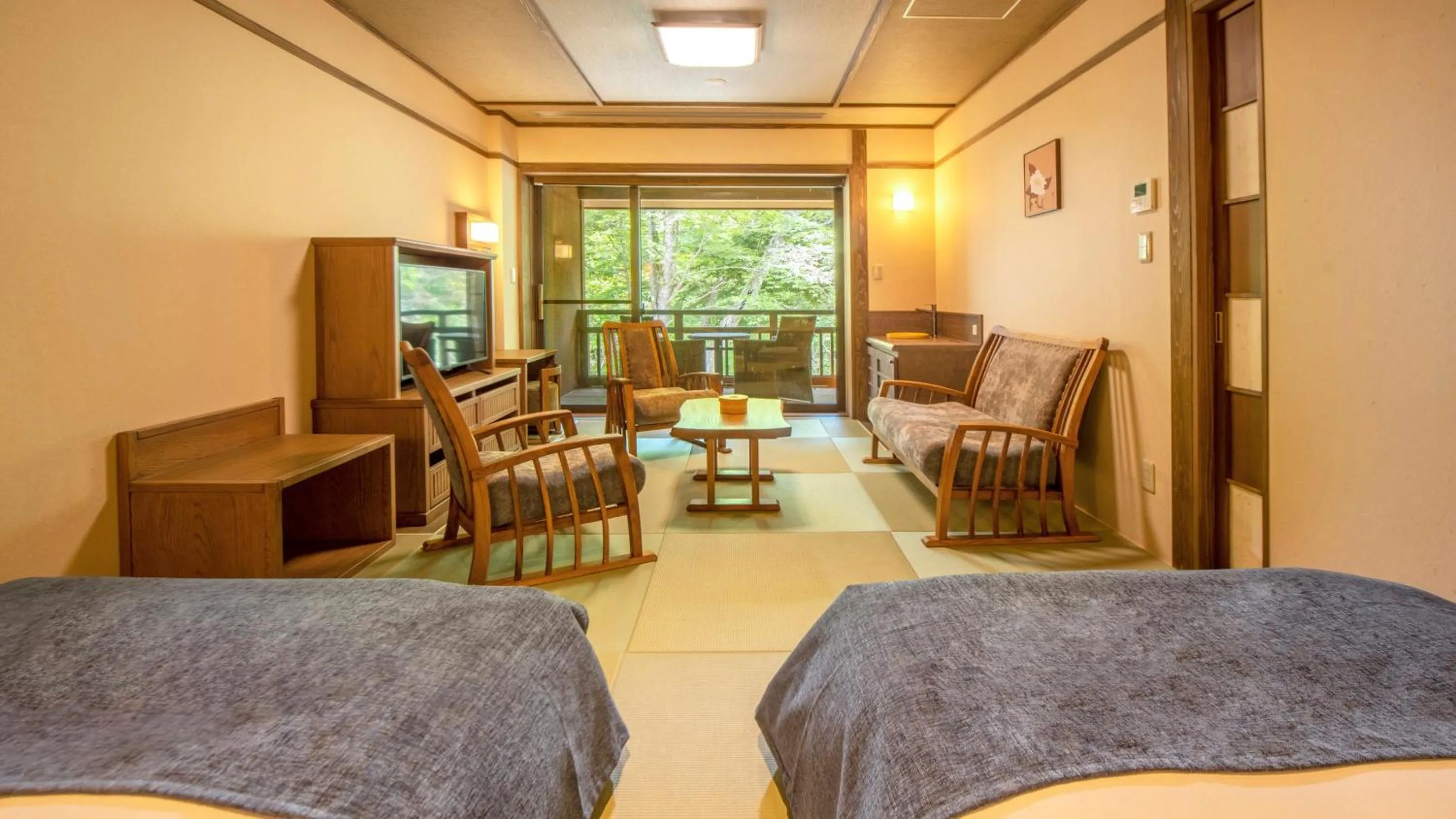 Bed in Shionoyu Onsen Rengetsu