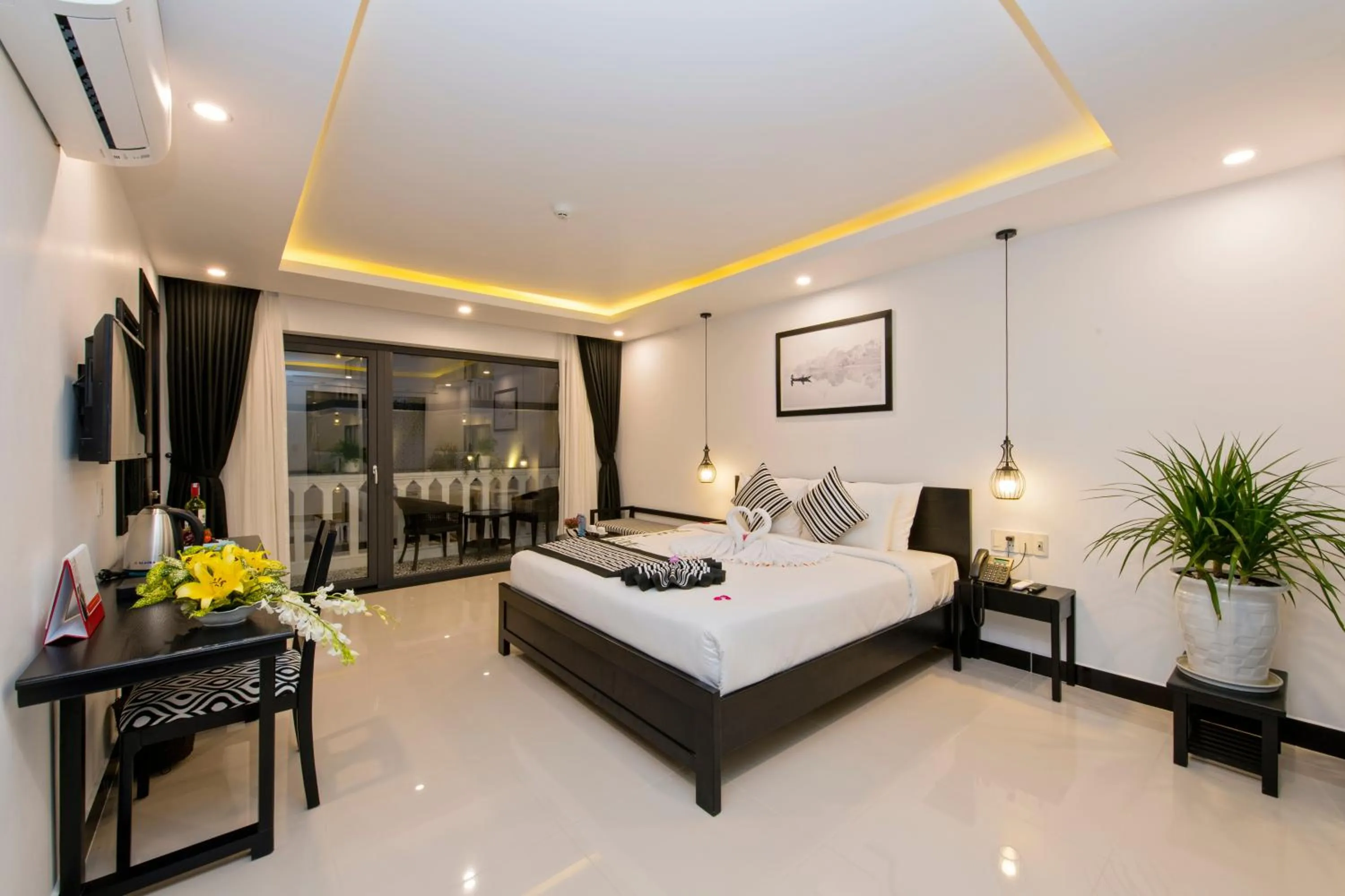 Photo of the whole room, Bed in Gem Riverside Hotel Hoi An