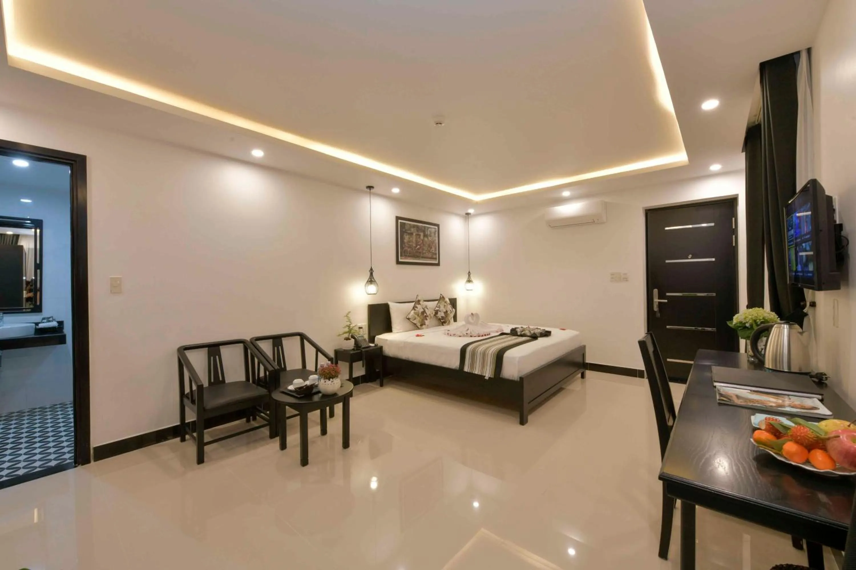 Living room, Bed in Gem Riverside Hotel Hoi An