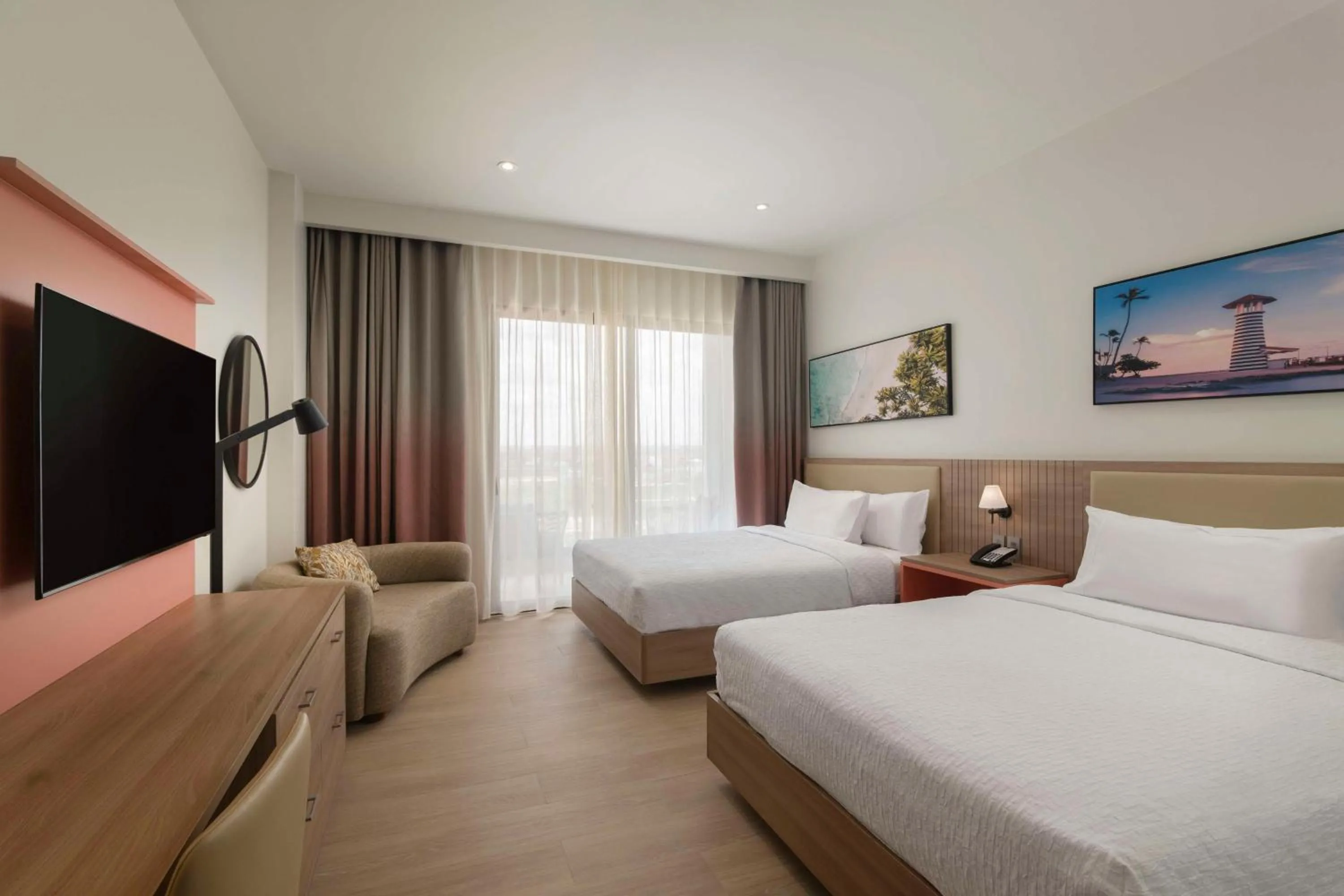 Living room, Bed in Hilton Garden Inn La Romana