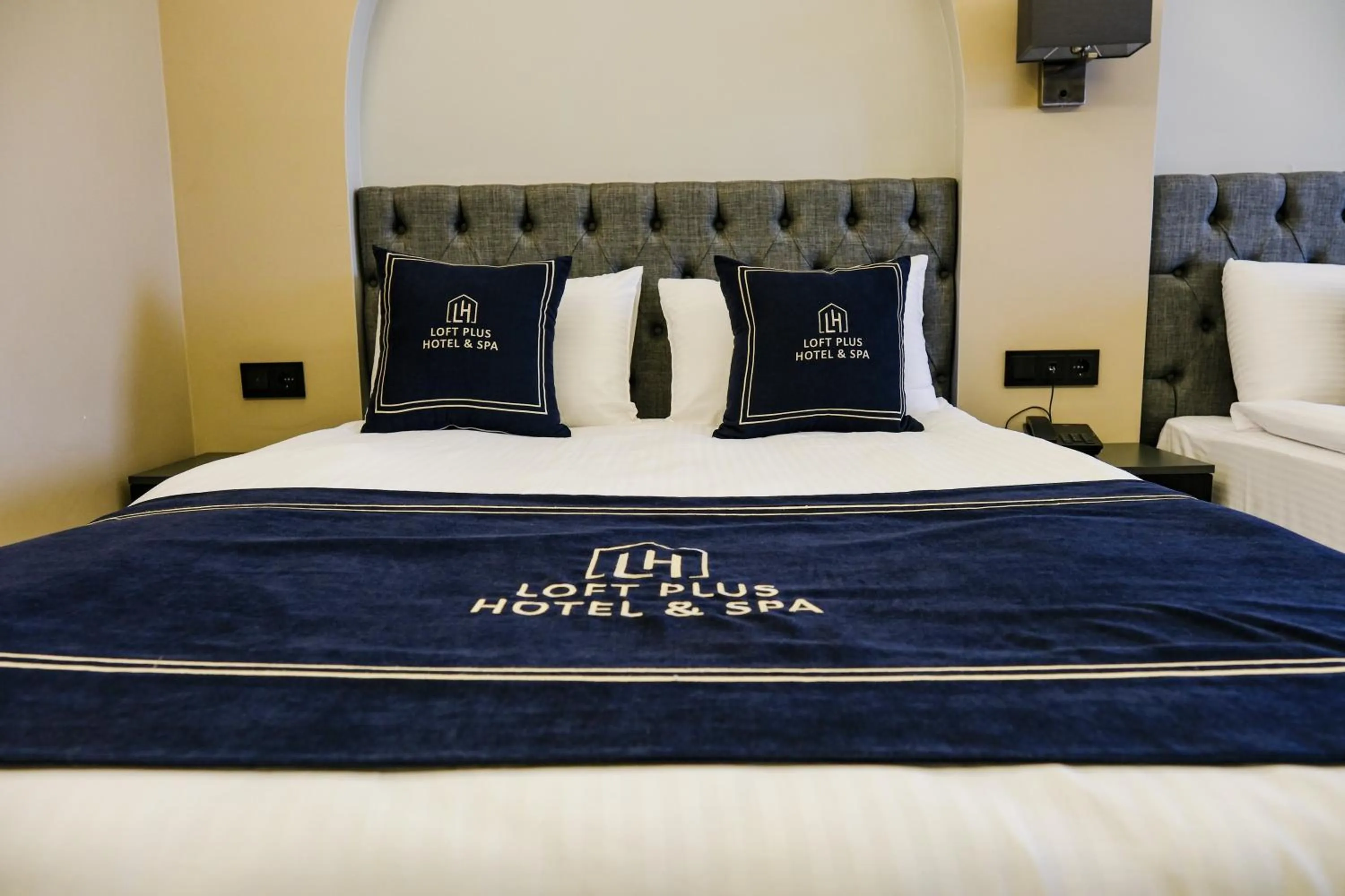 Bed in Loft Plus Hotel's