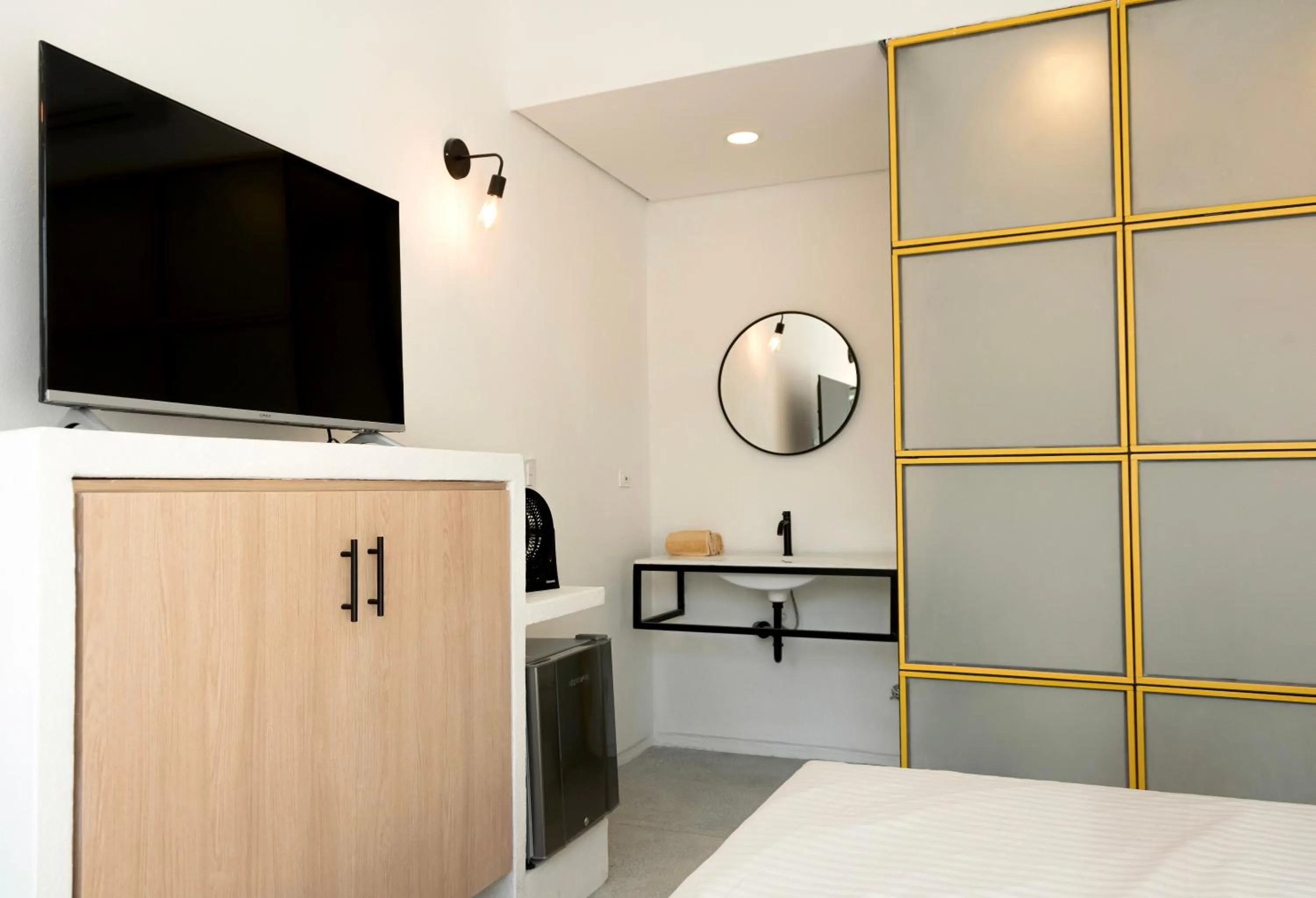 Bed in OASIS TROPICAL HOTEL