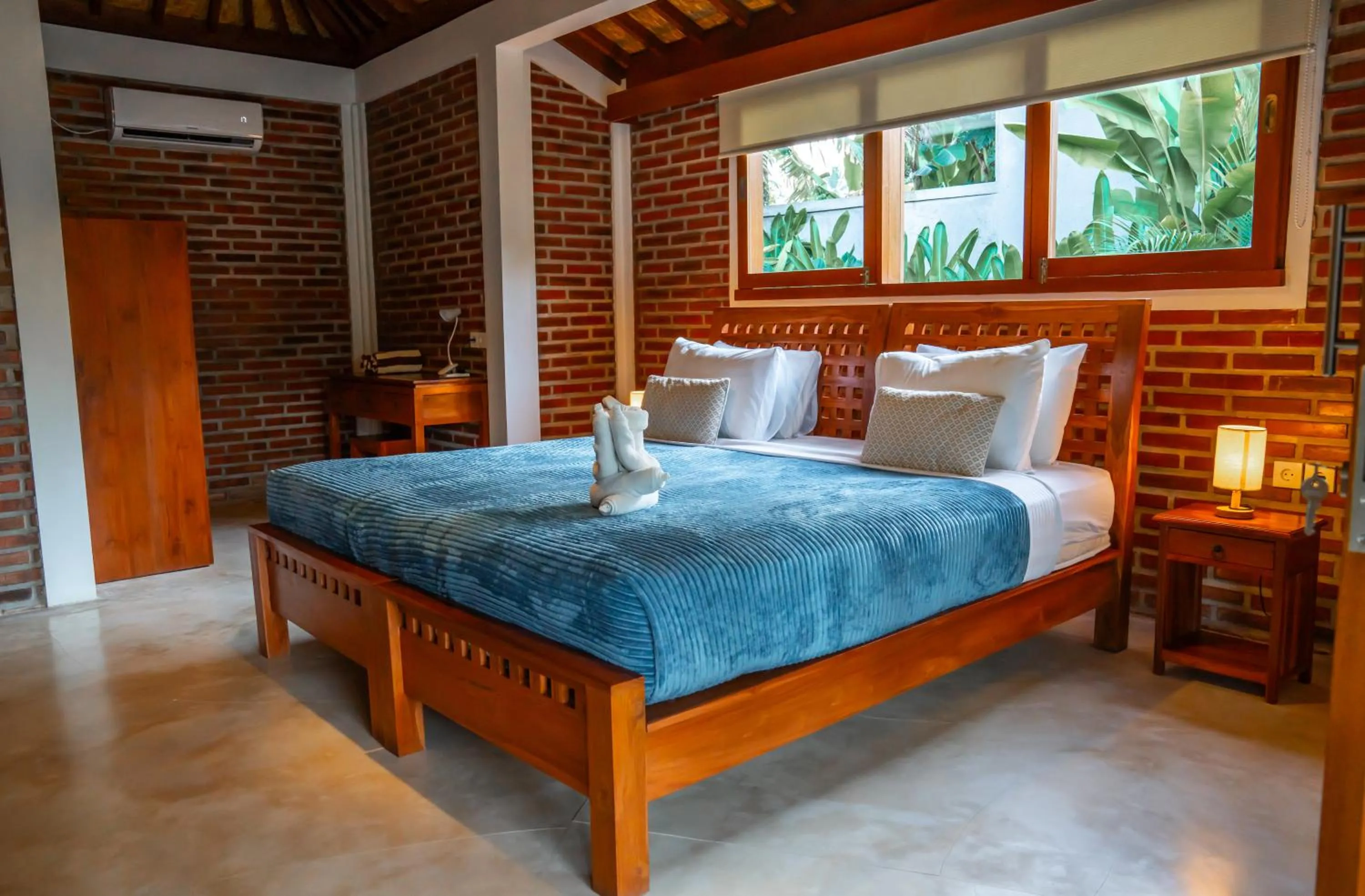 Bed in Kampung Uma Dawa Villas and Spa
