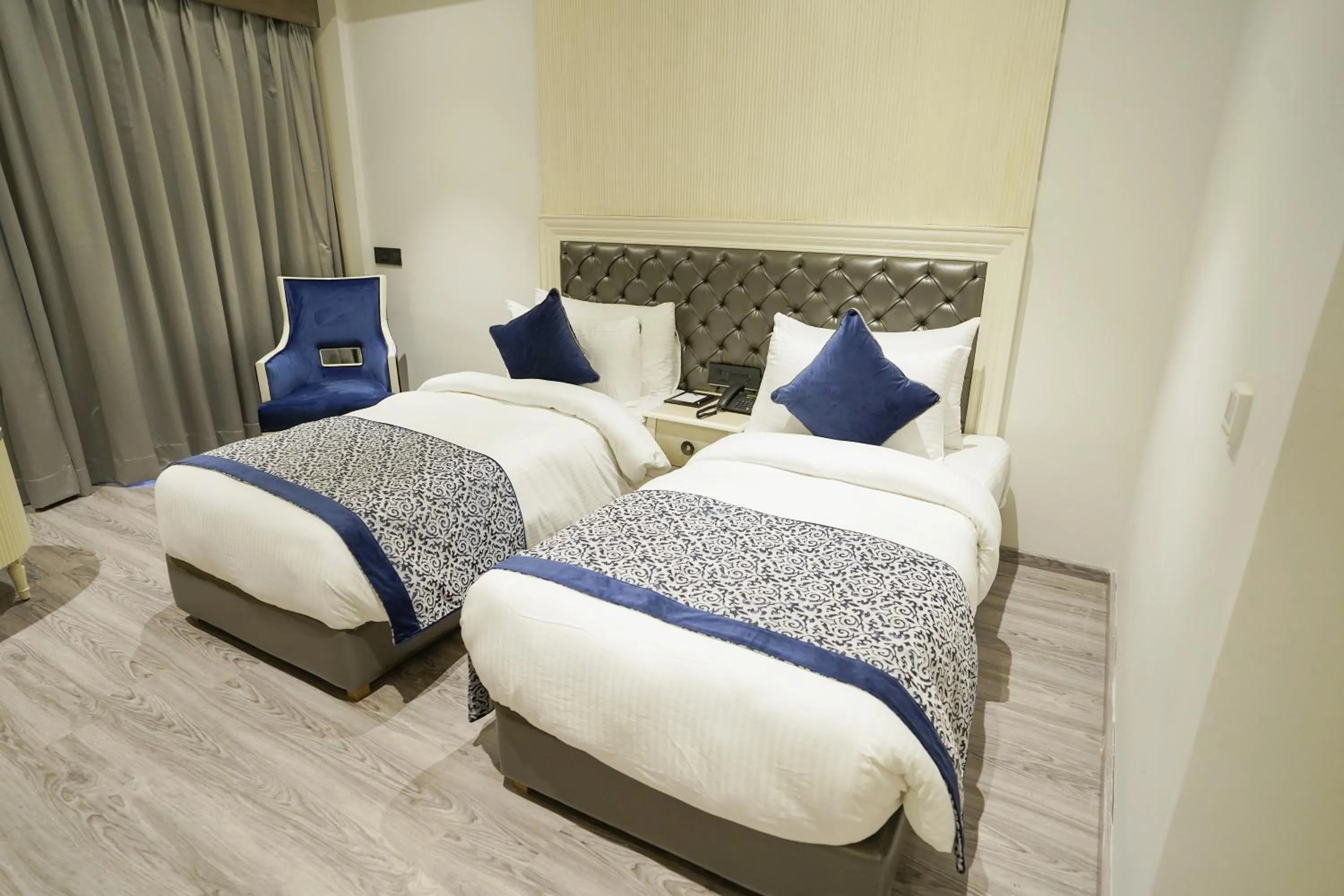 Bed in The Grand Nirvana Hotel