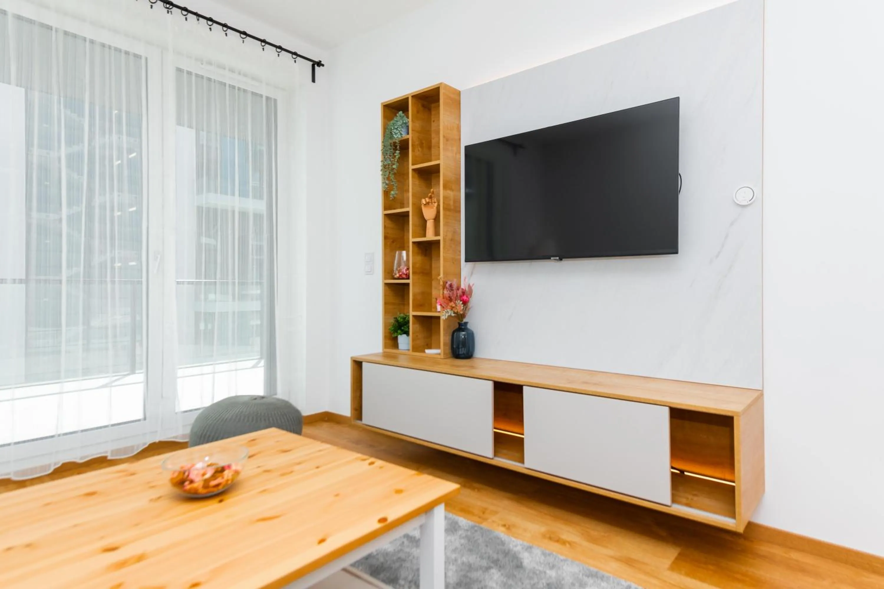 Communal lounge/ TV room in WaterFront City Apartments by FirstHost