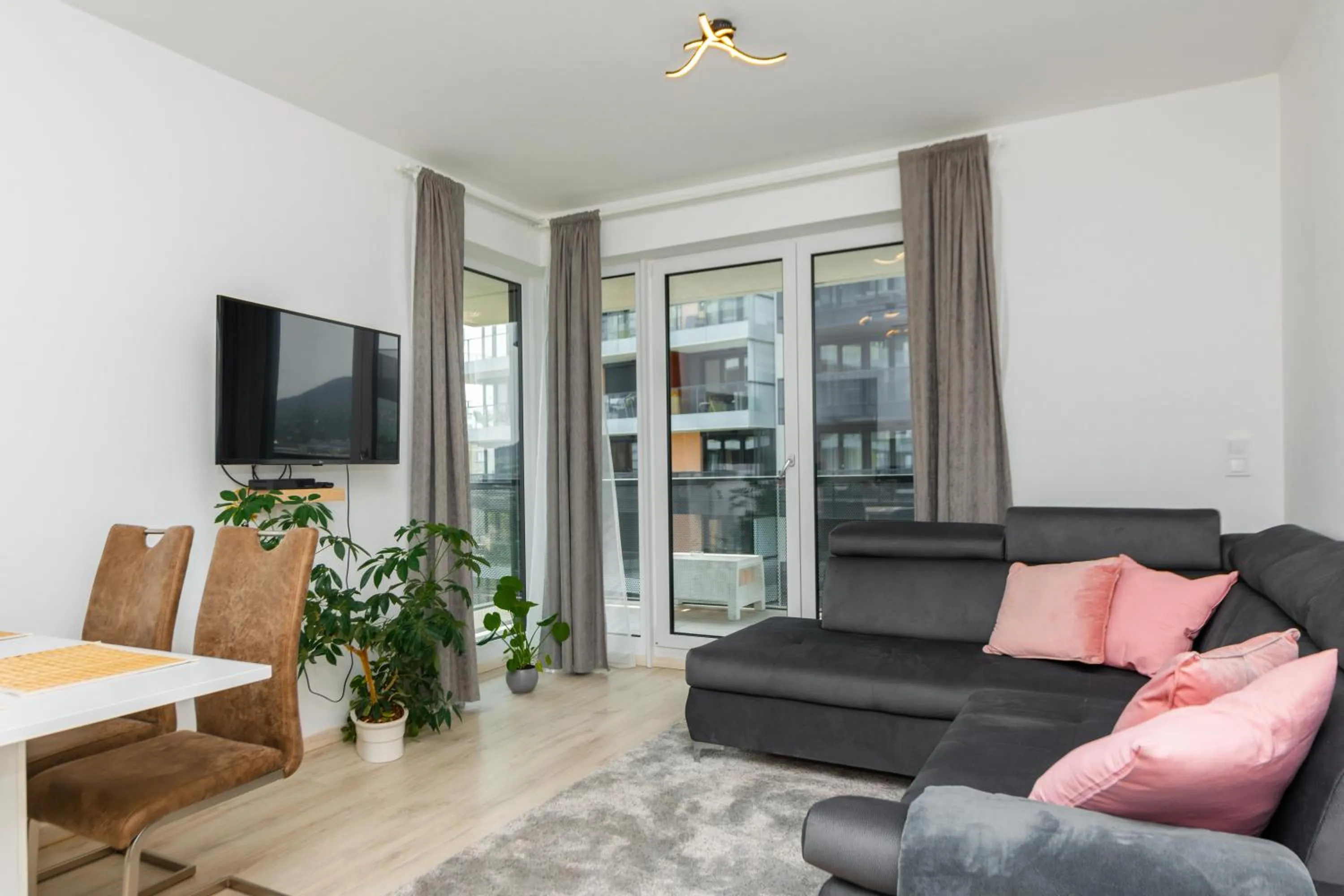 Communal lounge/ TV room in WaterFront City Apartments by FirstHost