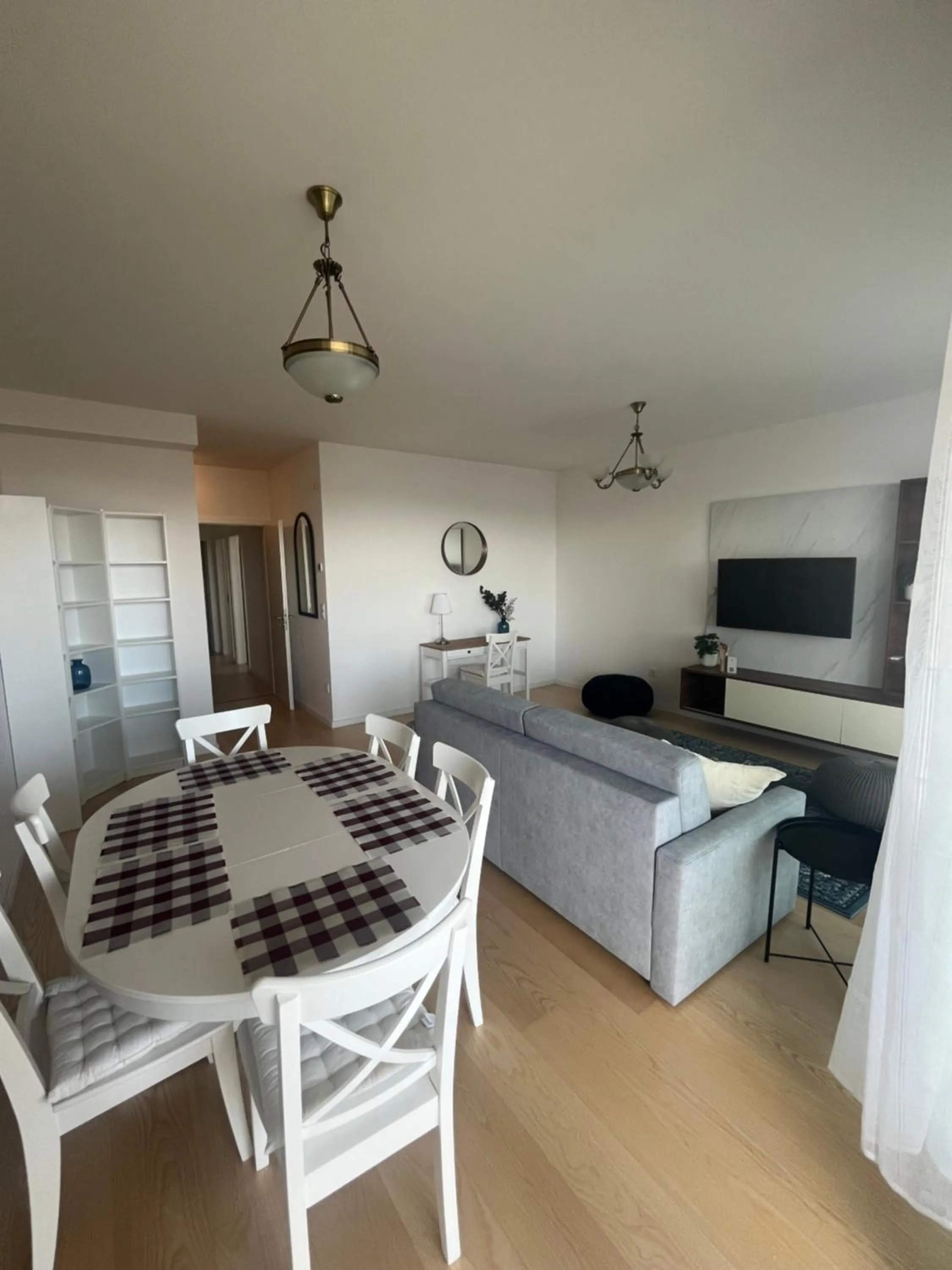 Communal lounge/ TV room, Bed in WaterFront City Apartments by FirstHost