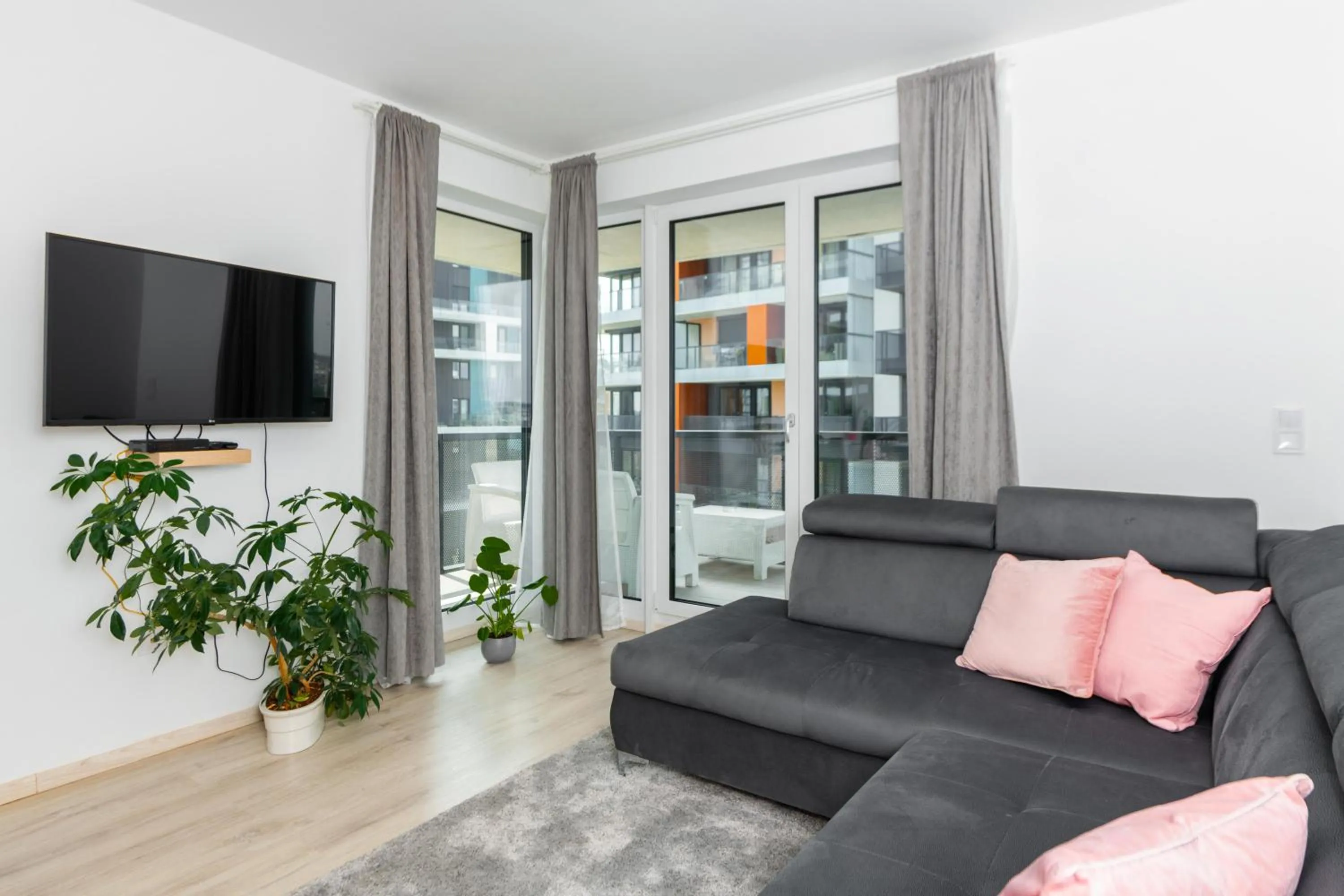 Communal lounge/ TV room in WaterFront City Apartments by FirstHost