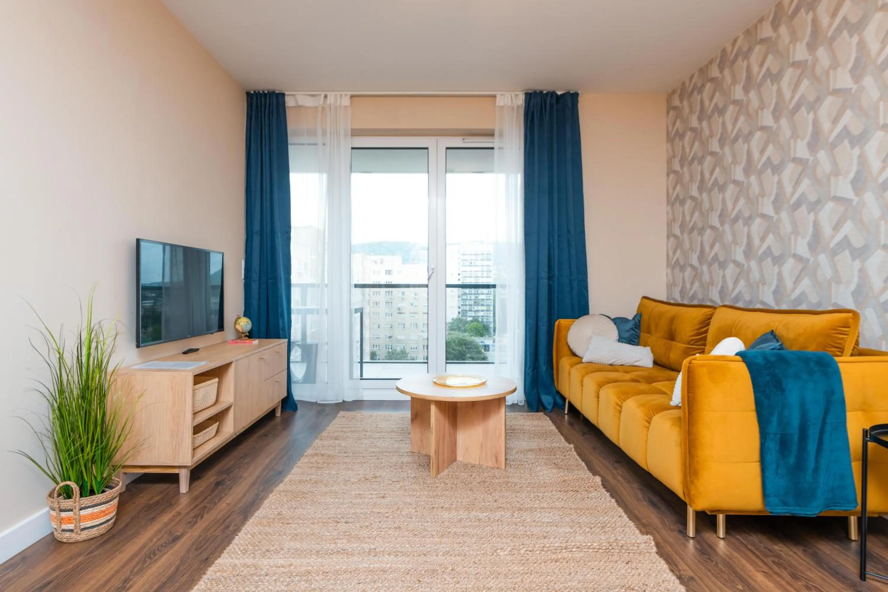 Communal lounge/ TV room in WaterFront City Apartments by FirstHost