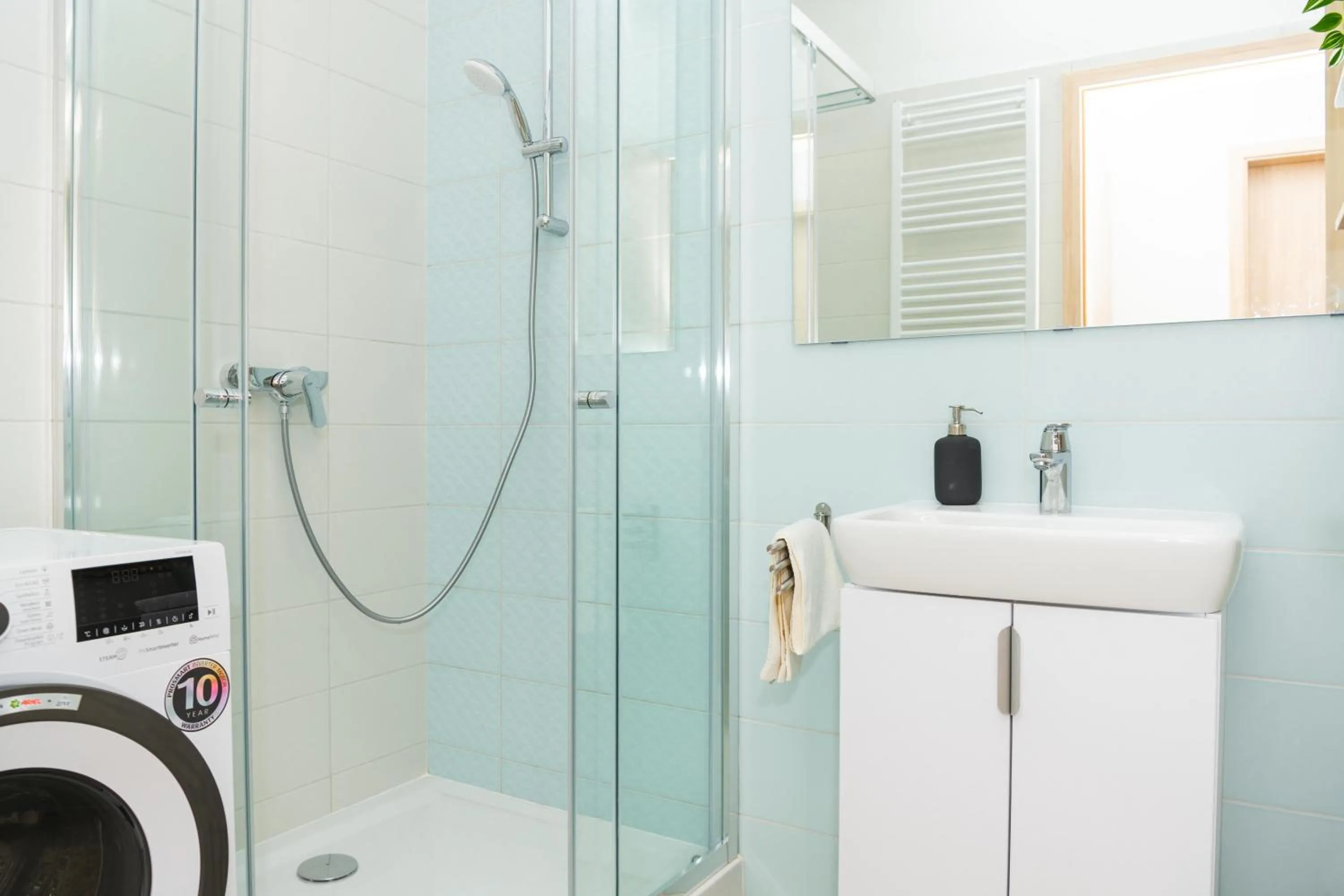 Shower in WaterFront City Apartments by FirstHost