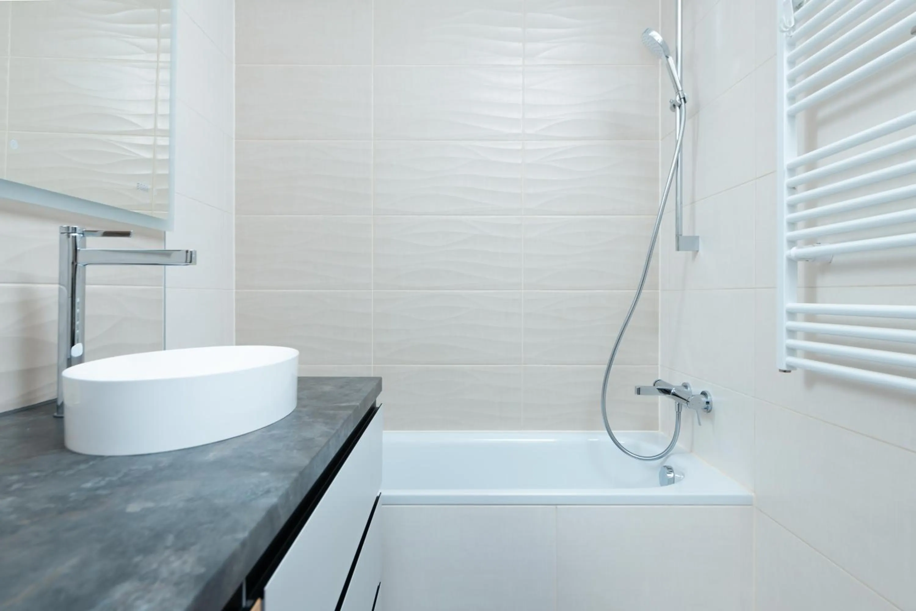 Shower in WaterFront City Apartments by FirstHost