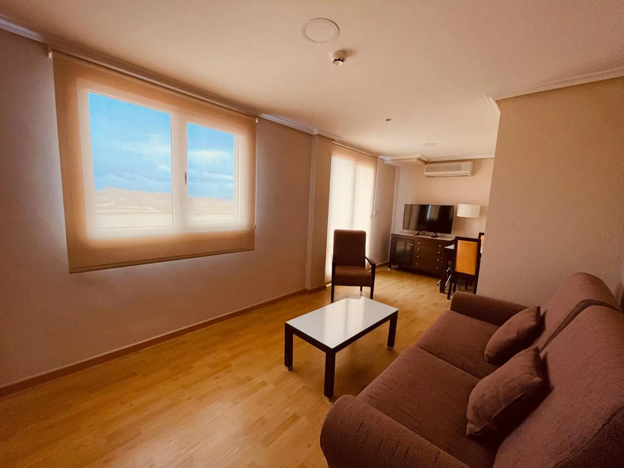 Communal lounge/ TV room in Aparthotel Arenteiro