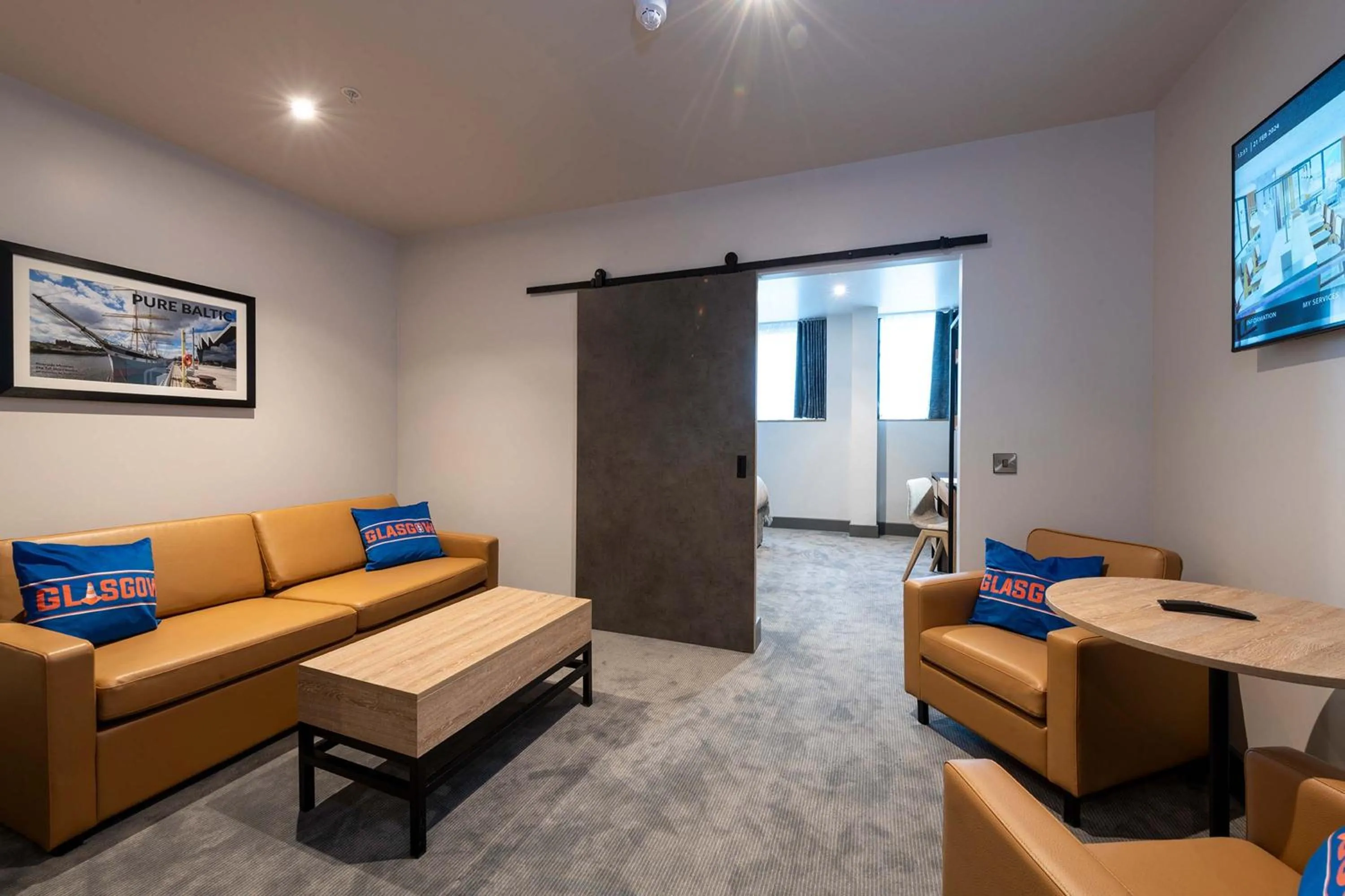 Living room in Sandman Signature Glasgow Hotel