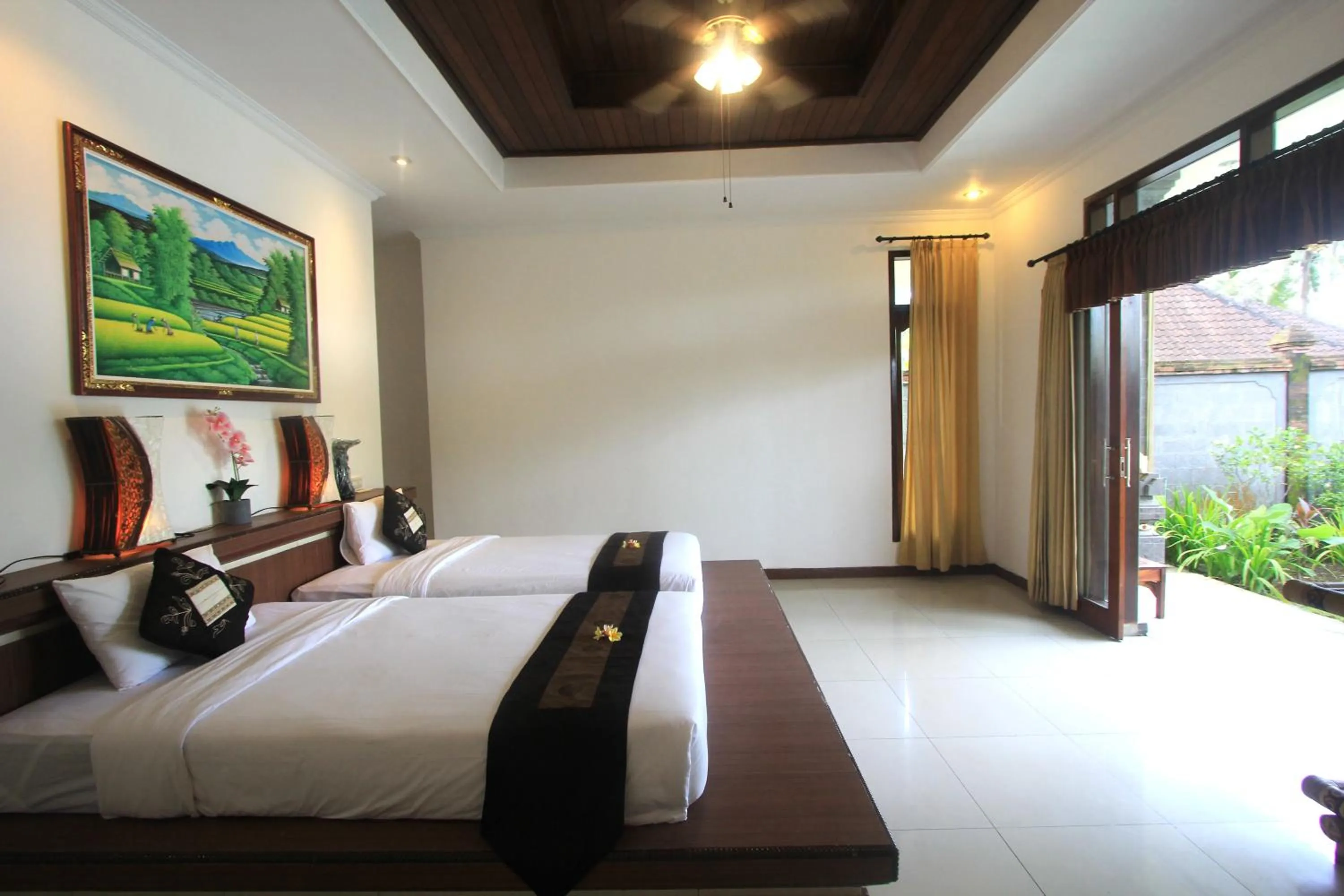 Bed in SUARA SIDHI Villa Ubud Bali