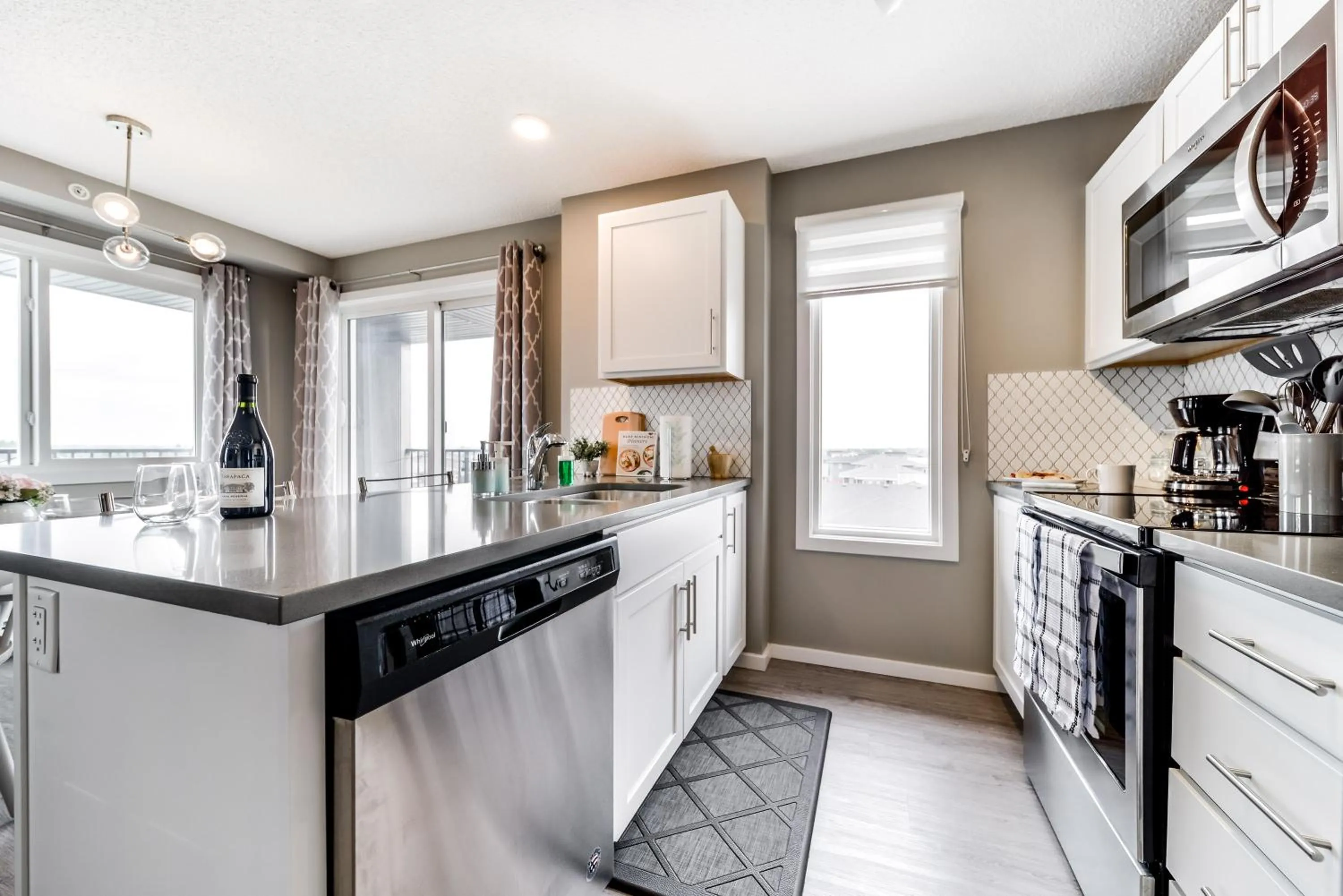 kitchen in Peaceful Oasis Condo, AC, Top Floor, Secure UG Parking, Balcony, King Bed!