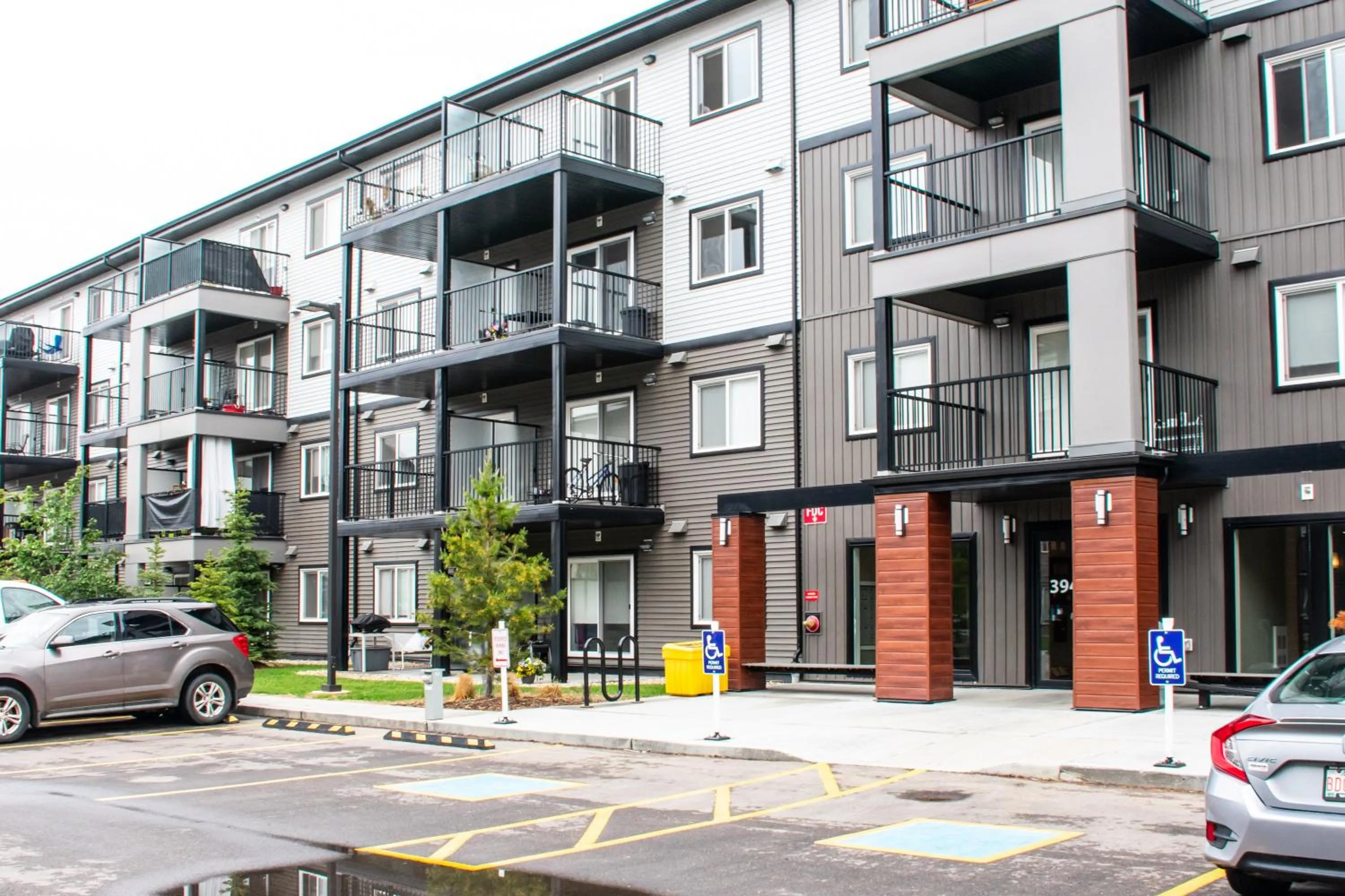 Facade/entrance in Peaceful Oasis Condo, AC, Top Floor, Secure UG Parking, Balcony, King Bed!