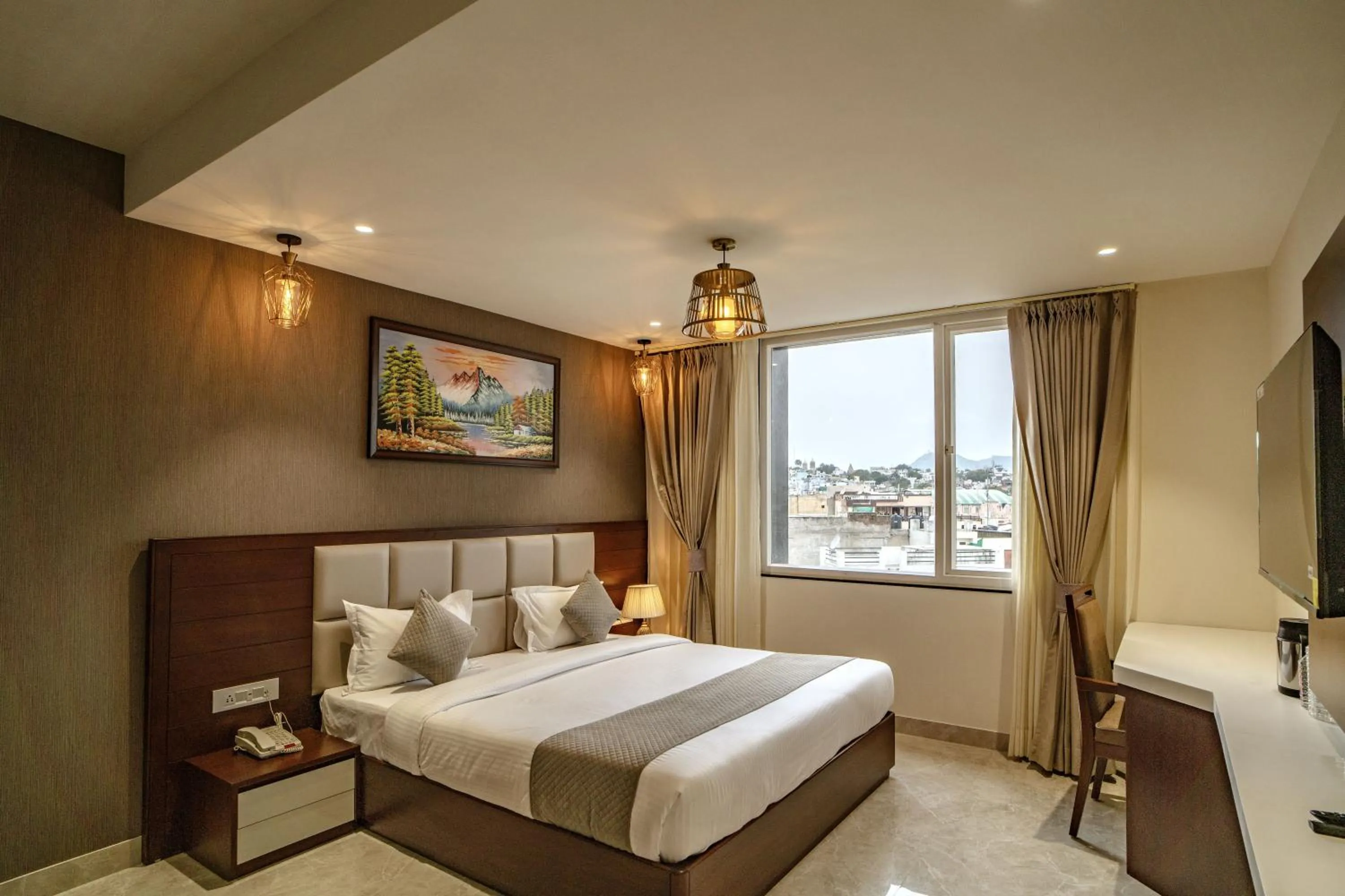 Bed in THE MANGAL VIEW RESIDENCY - A Luxury Boutique Business Hotel