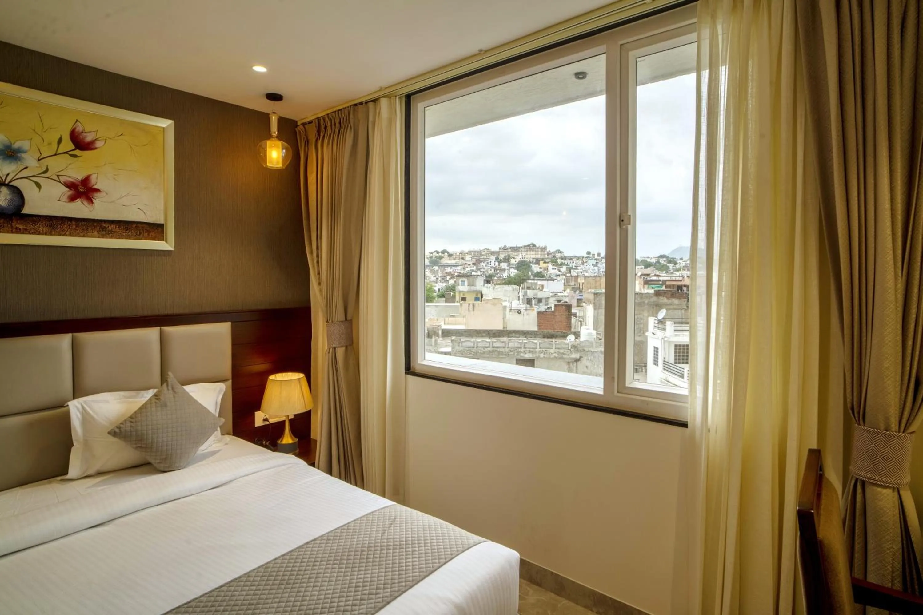 Bed in THE MANGAL VIEW RESIDENCY - A Luxury Boutique Business Hotel