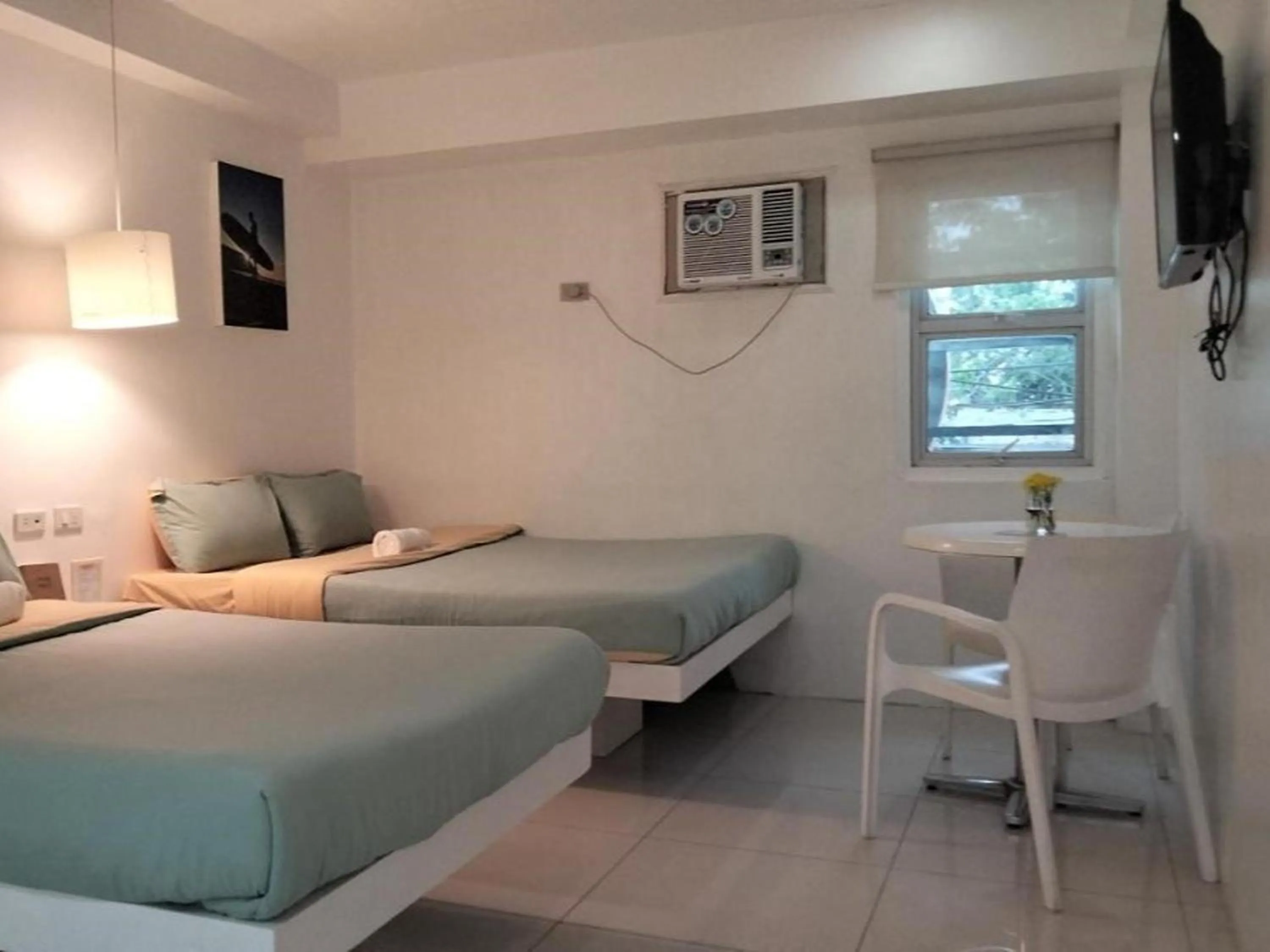 Bed in Wanderlust Bed and Breakfast Puerto Princesa
