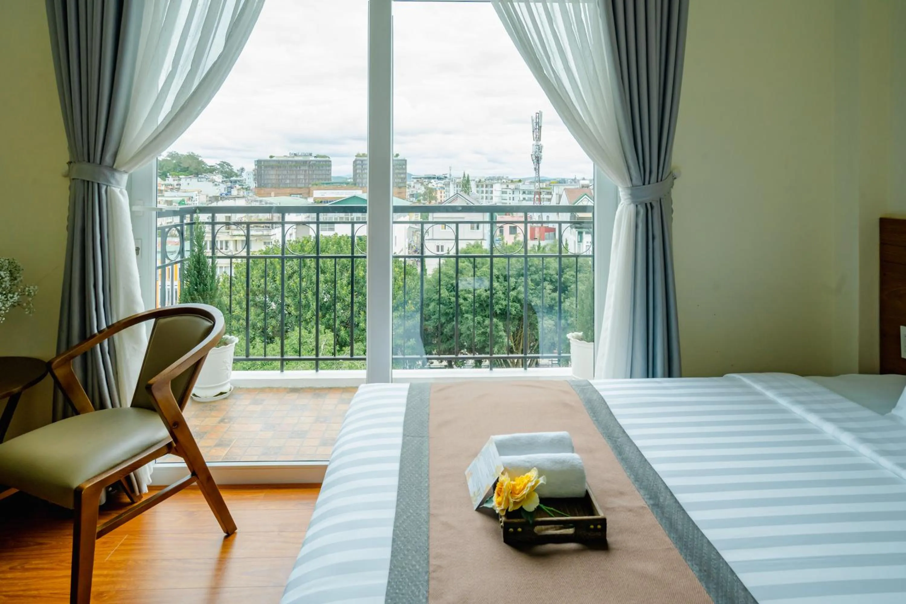 View (from property/room), Bed in Bombo DaLat Hotel