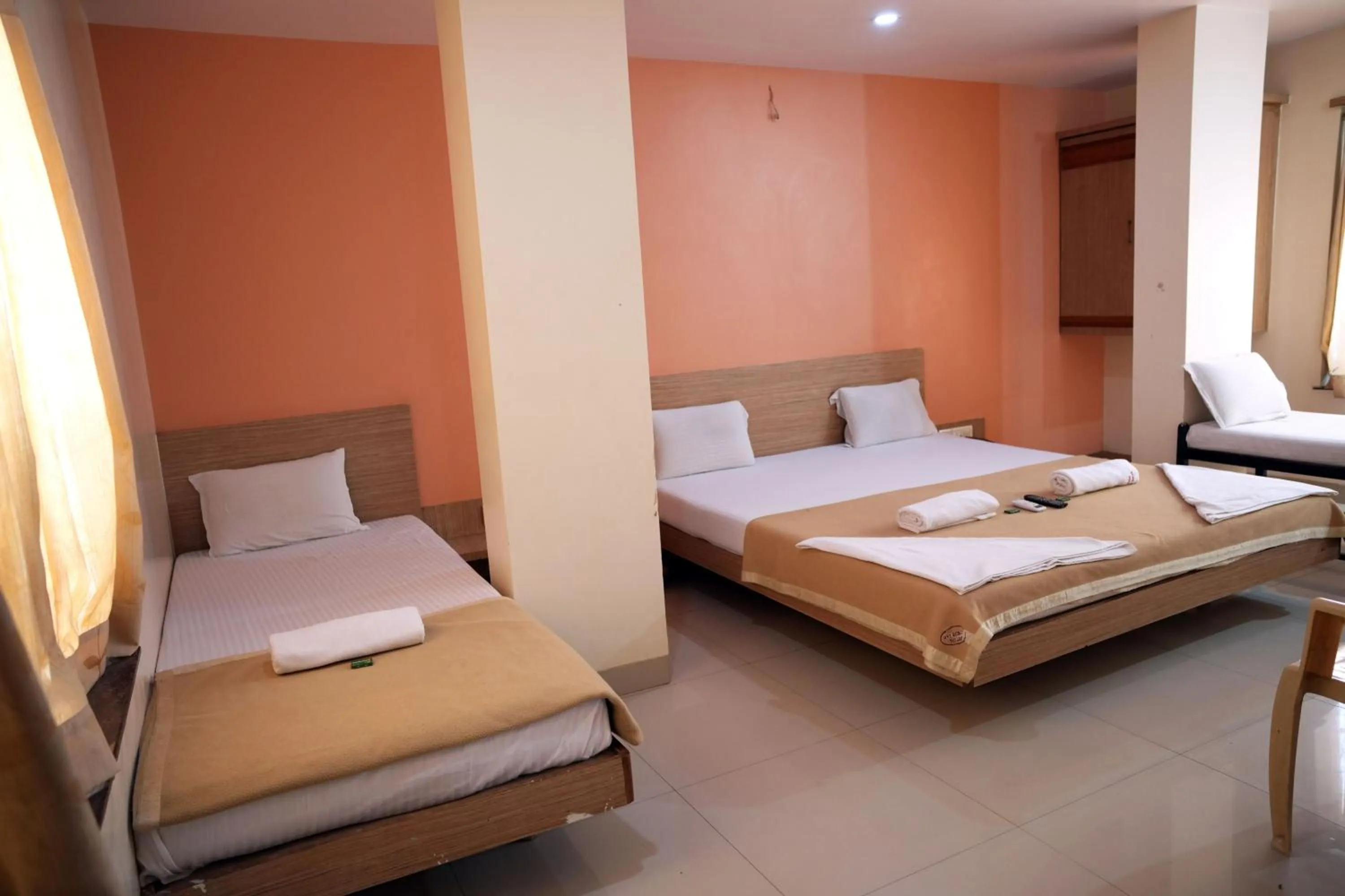 Bed in HOTEL SAI SURYA