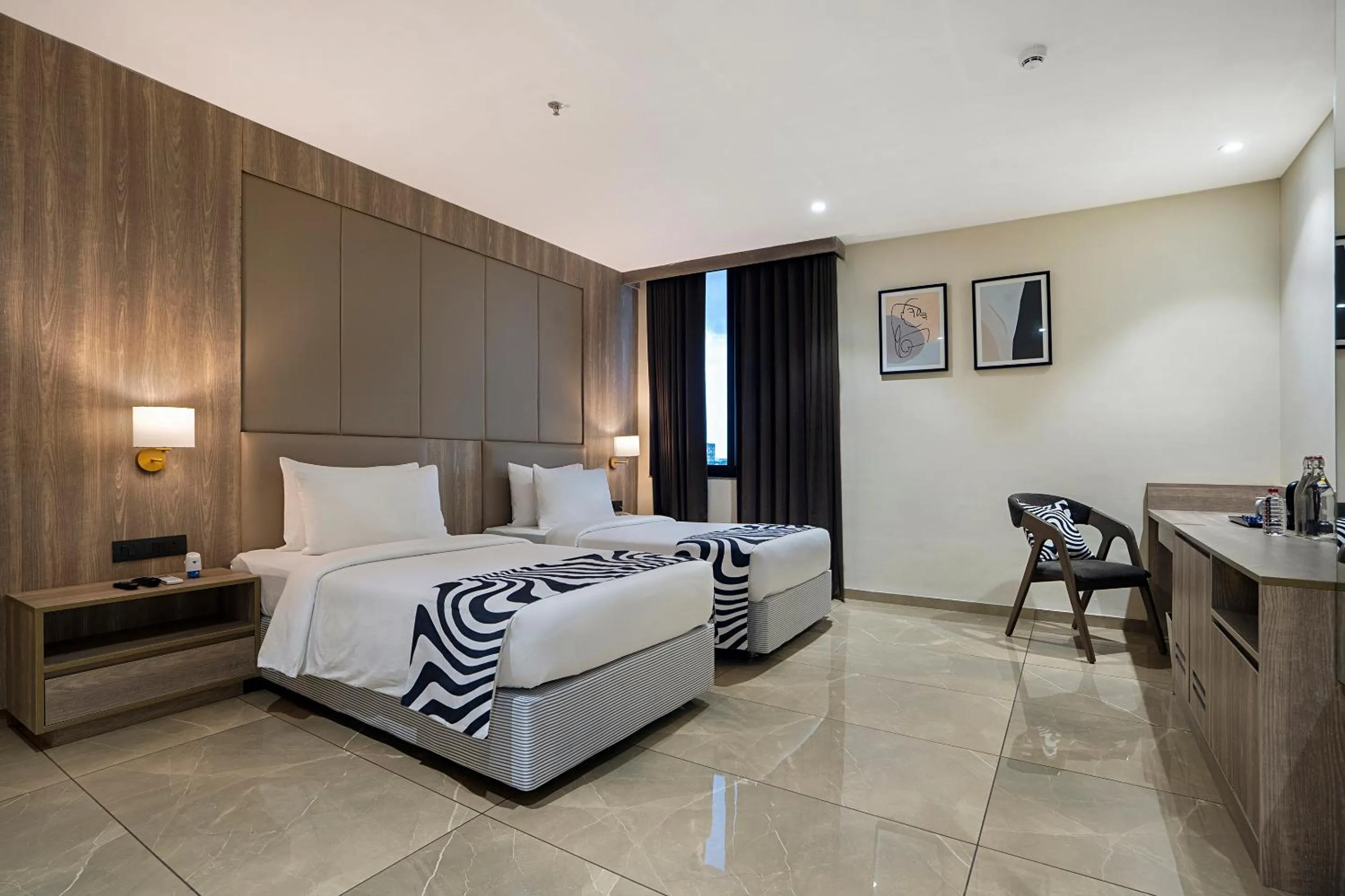 Bed in Sunday Hotel by CheckIn Vadodara