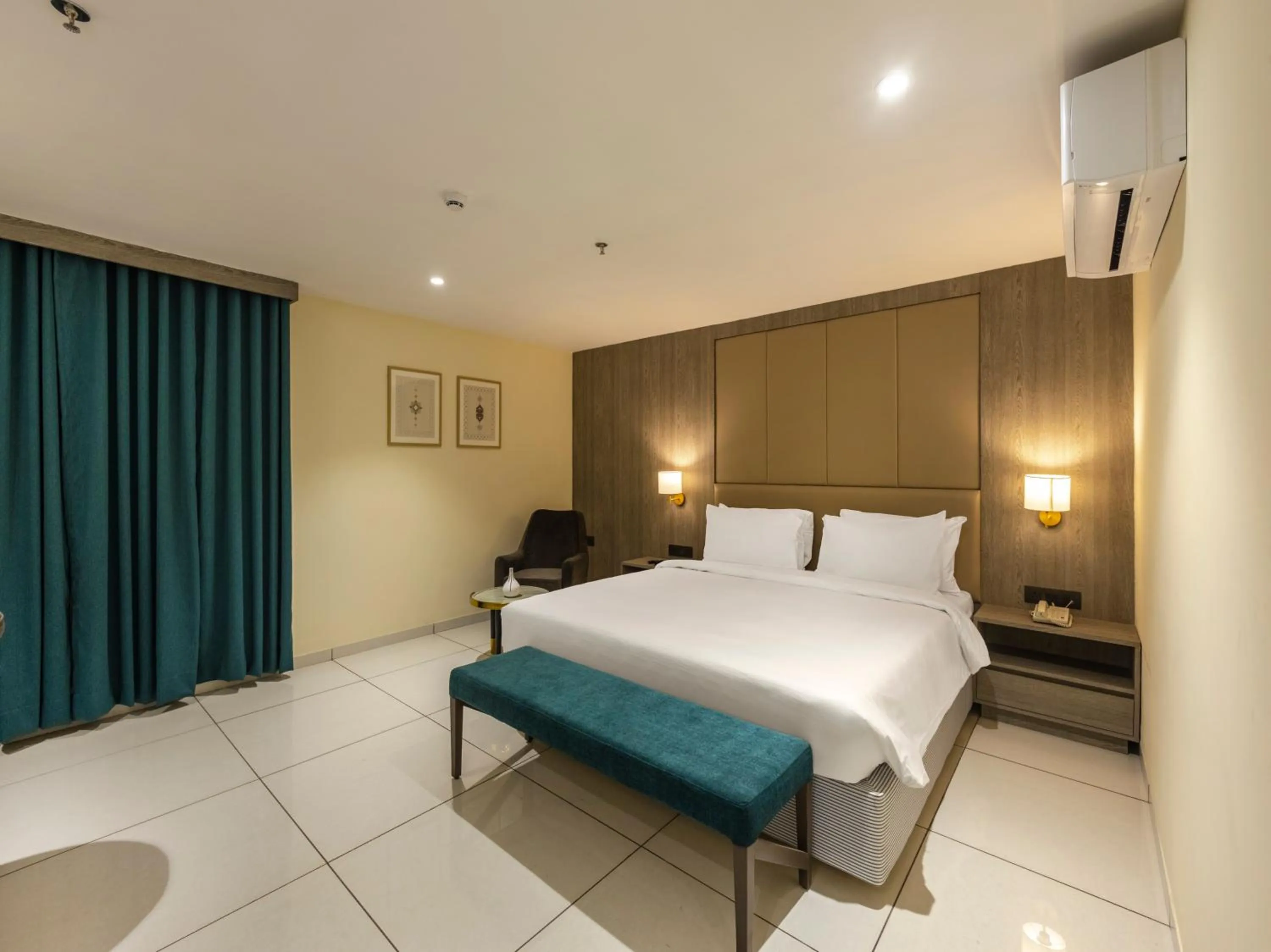 Photo of the whole room, Bed in Sunday Hotel by CheckIn Vadodara