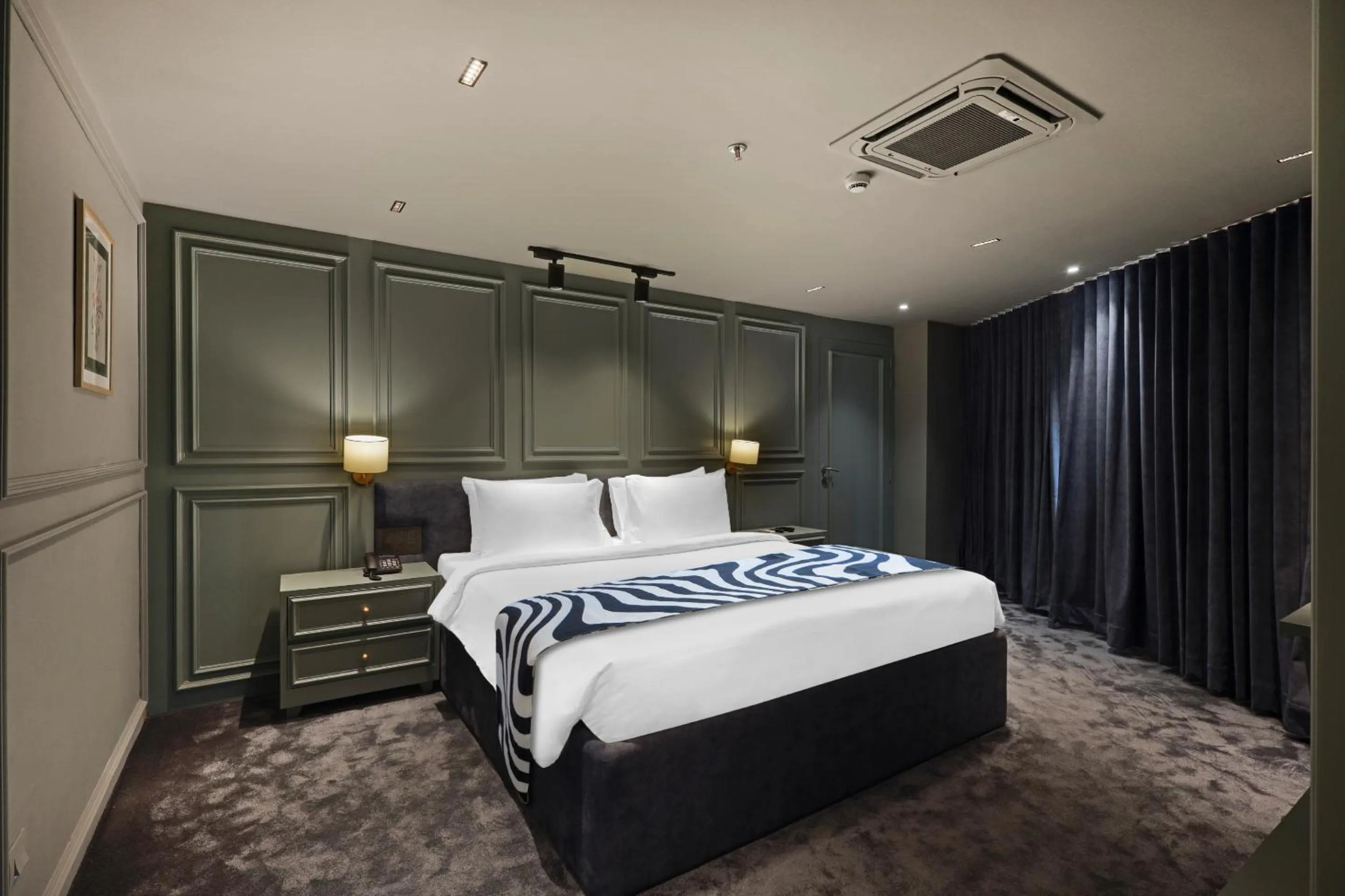 Bed in Sunday Hotel by CheckIn Vadodara