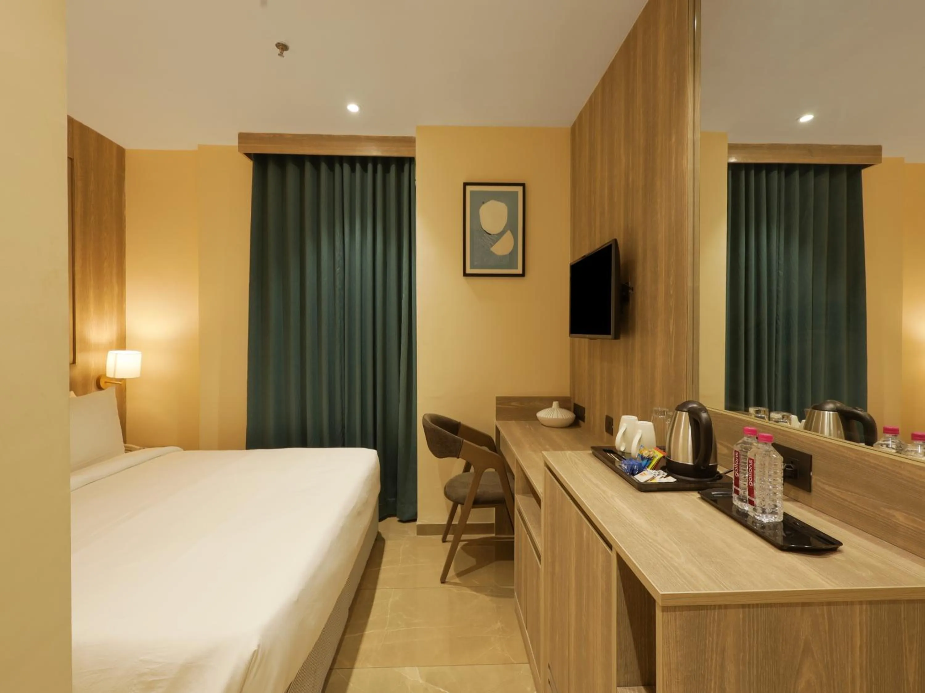 Photo of the whole room, Bed in Sunday Hotel by CheckIn Vadodara