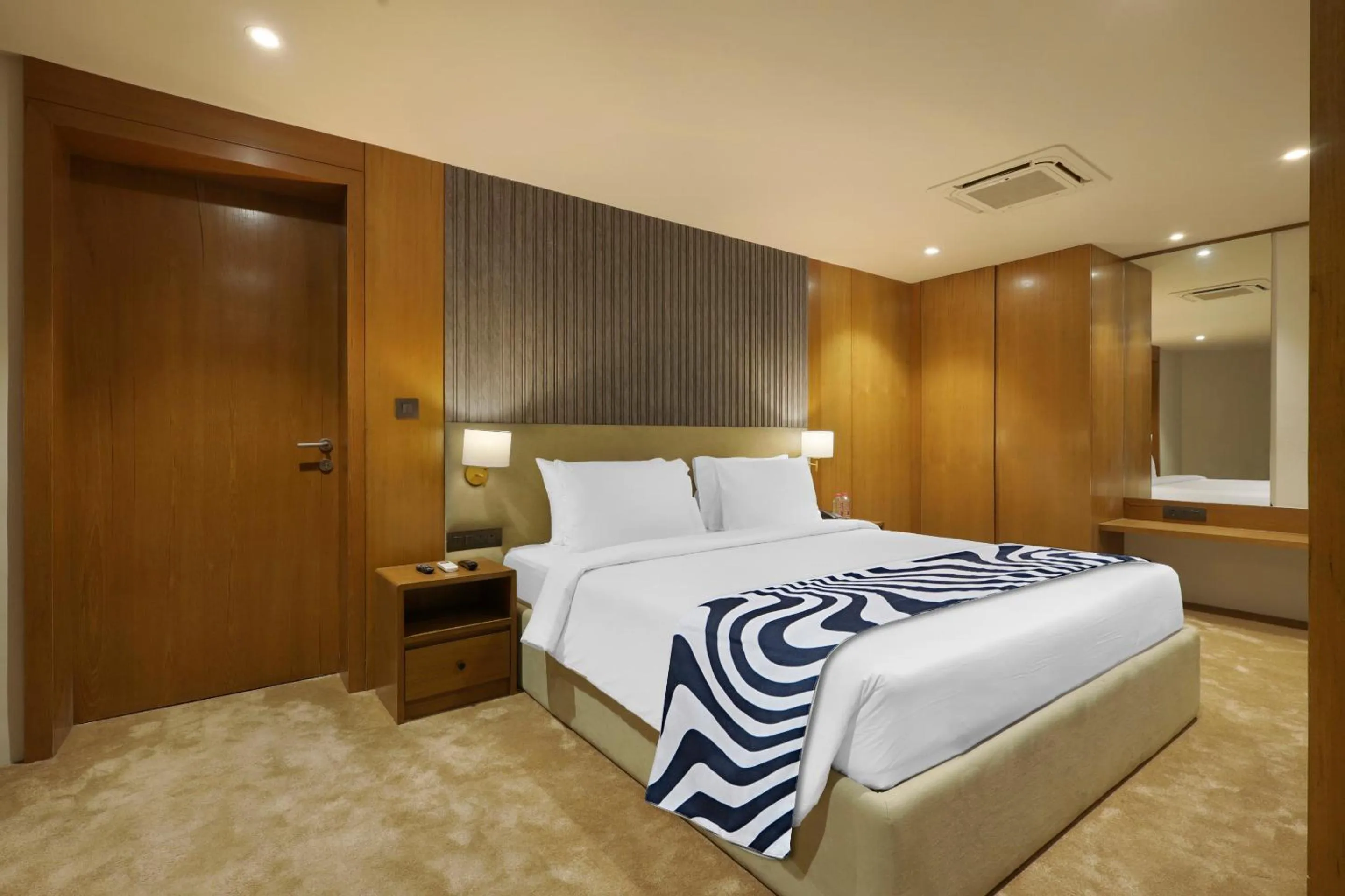 Bed in Sunday Hotel by CheckIn Vadodara