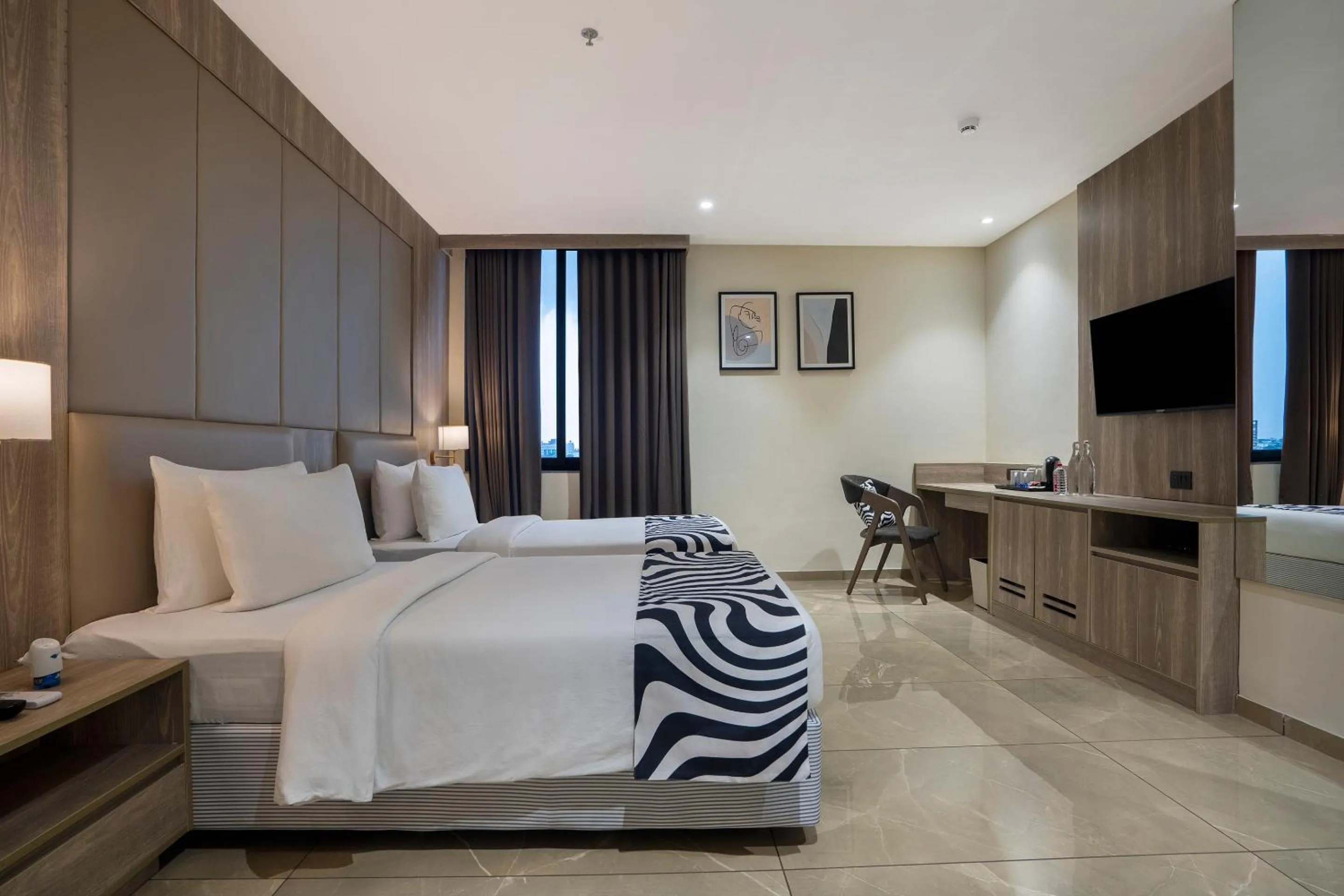 Bed in Sunday Hotel by CheckIn Vadodara