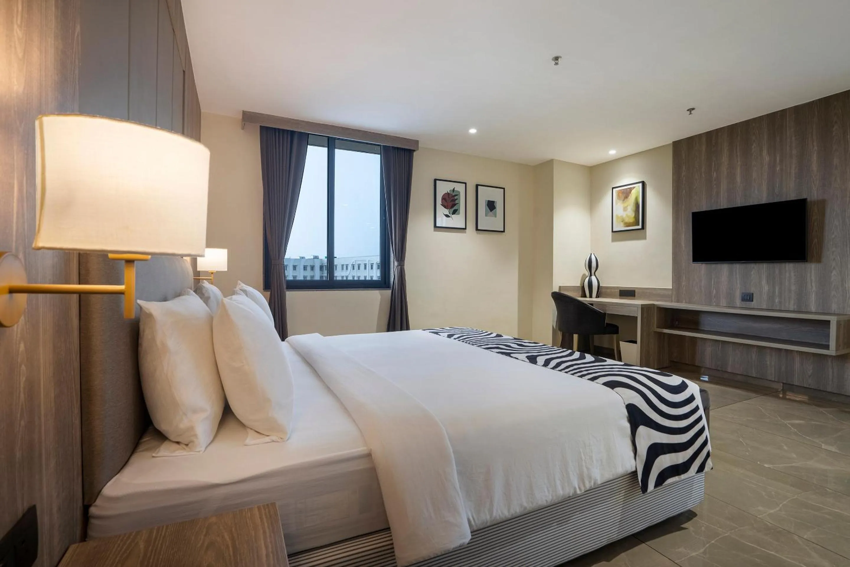 Bed in Sunday Hotel by CheckIn Vadodara