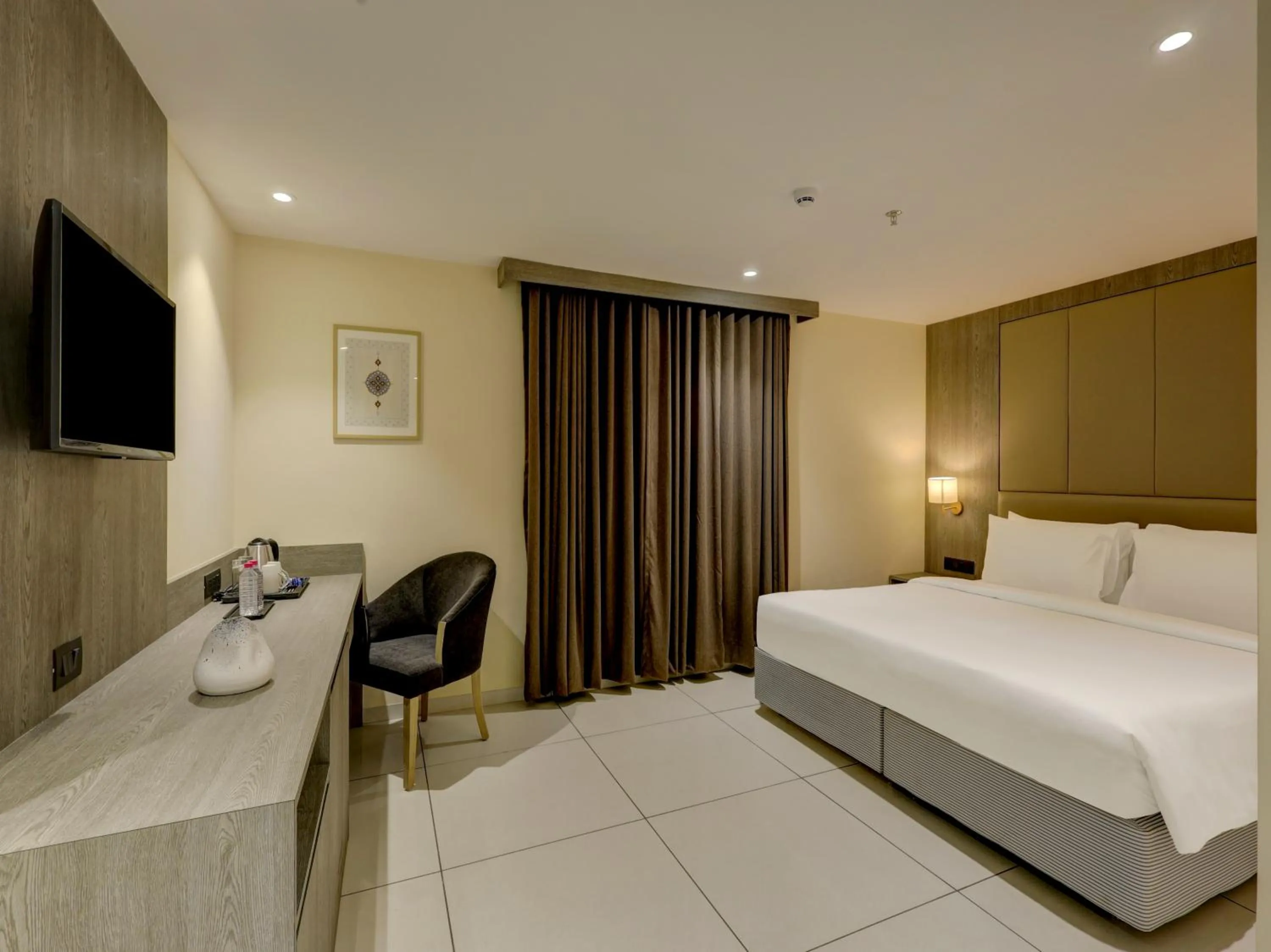 Bed in Sunday Hotel by CheckIn Vadodara