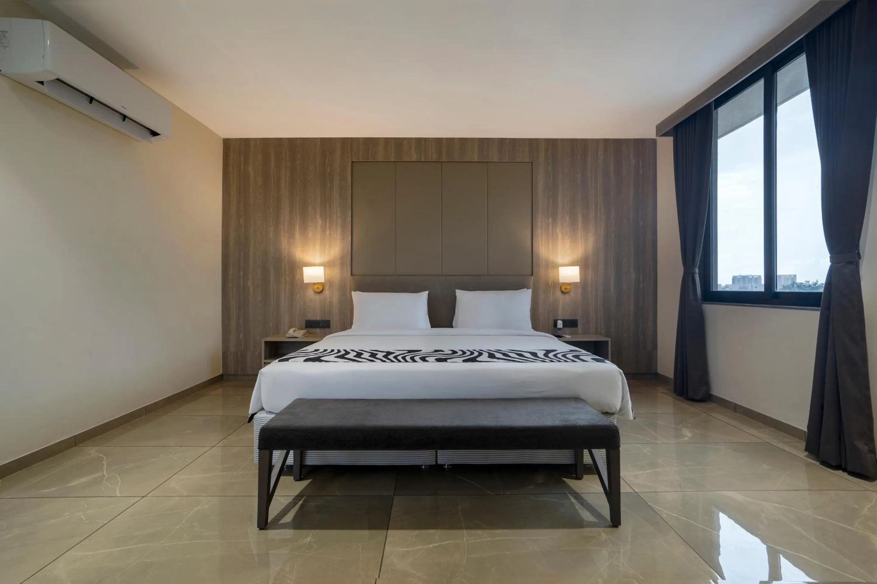 Photo of the whole room, Bed in Sunday Hotel by CheckIn Vadodara