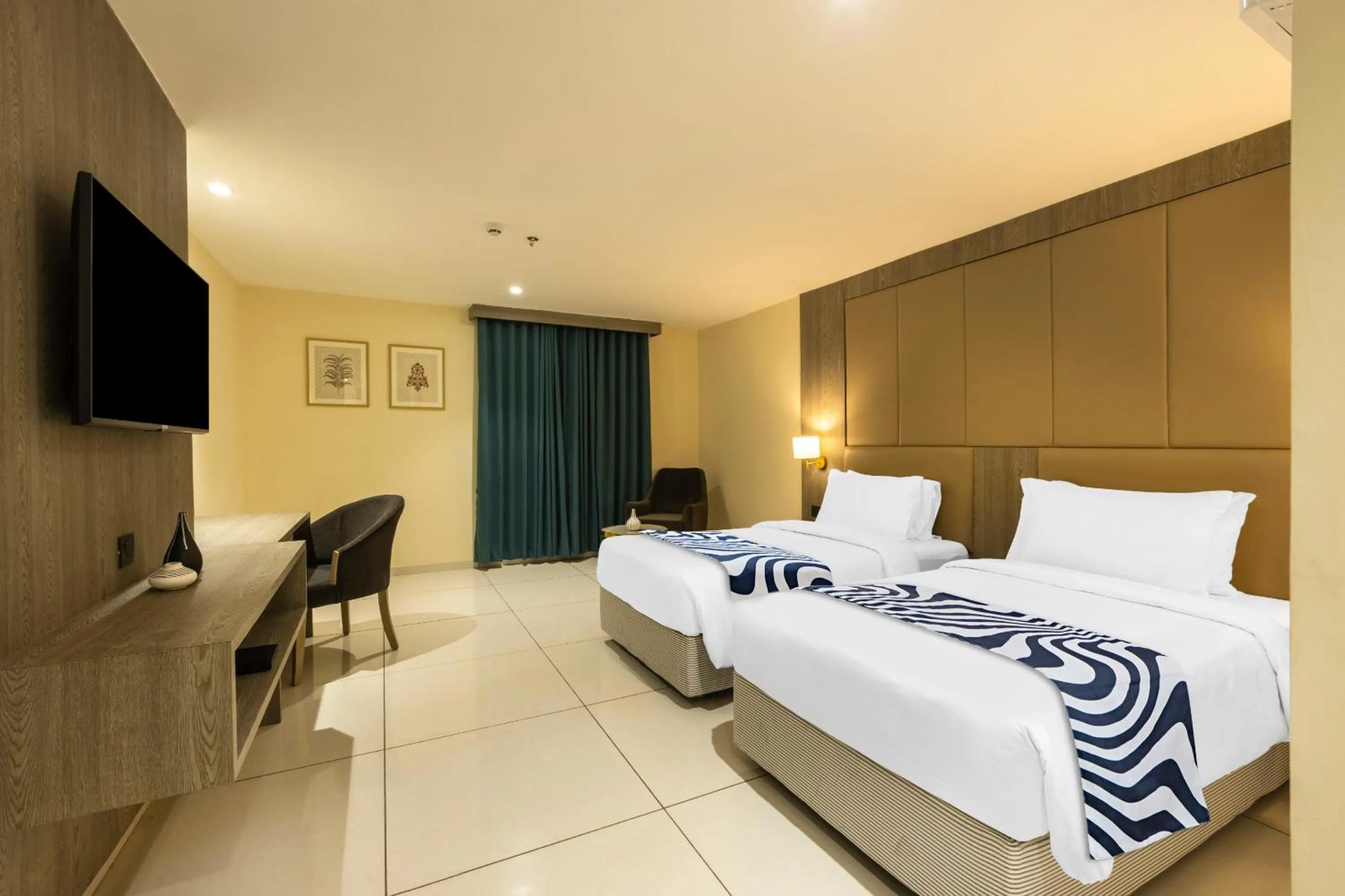 Bed in Sunday Hotel by CheckIn Vadodara