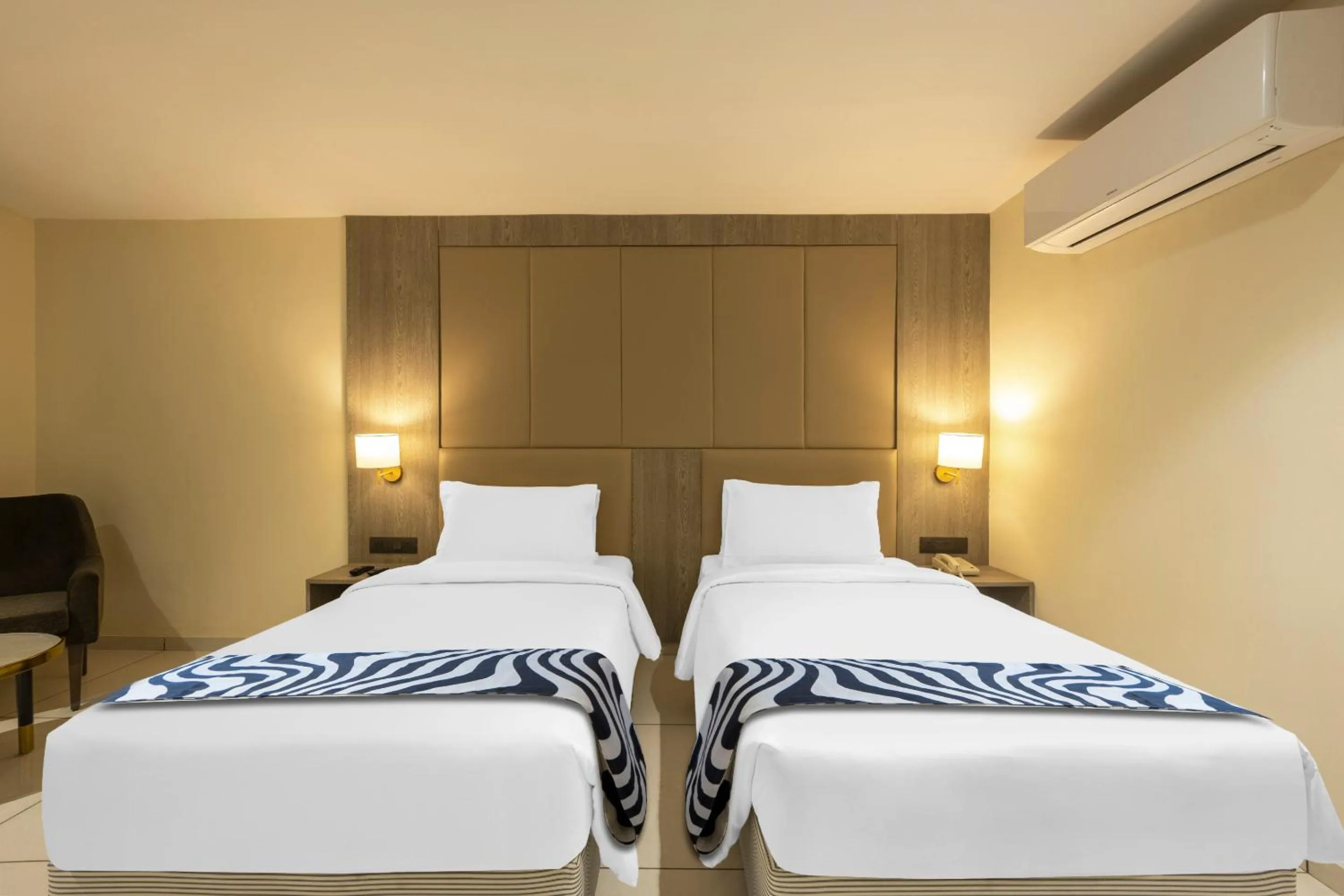 Bed in Sunday Hotel by CheckIn Vadodara
