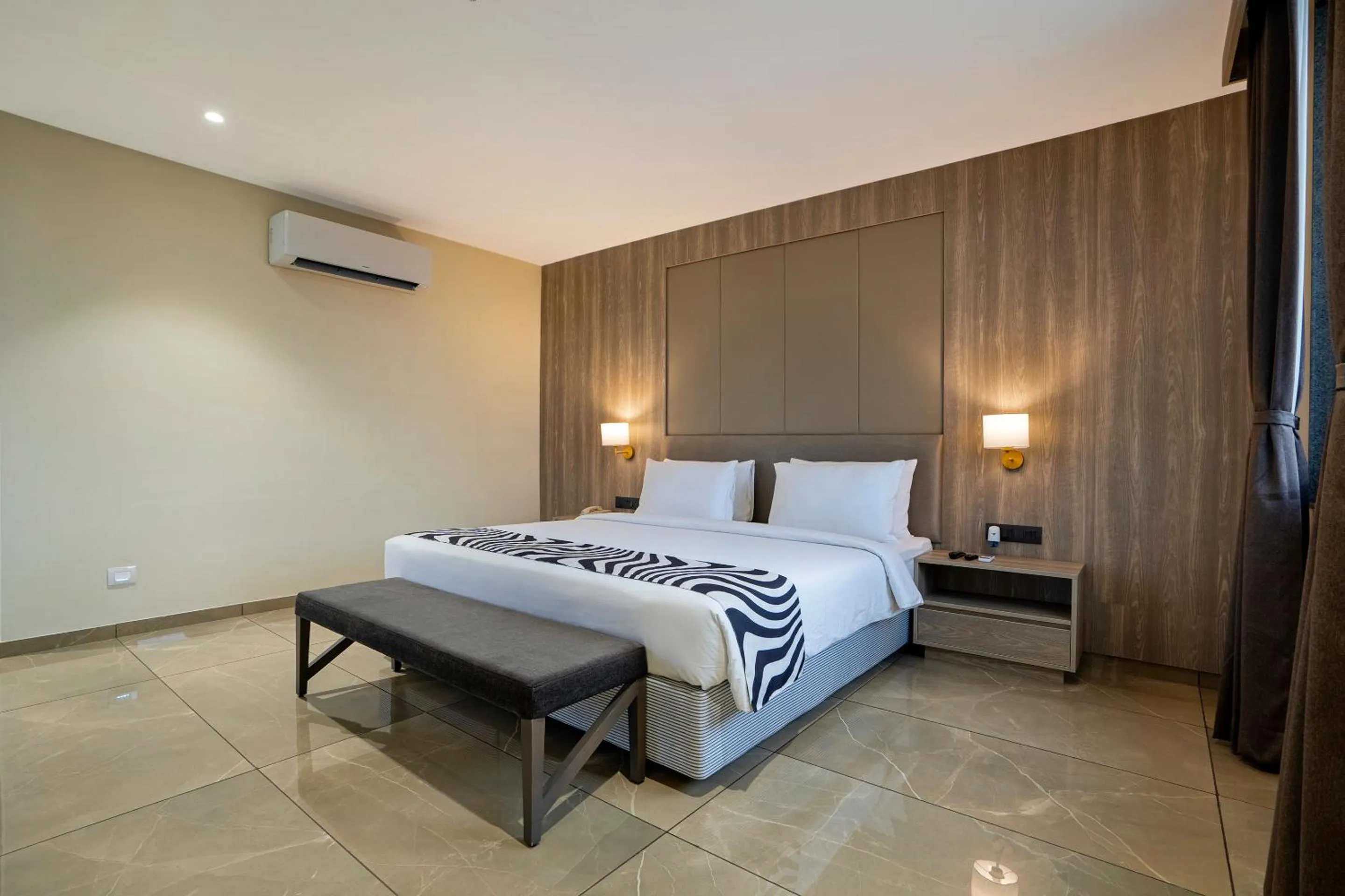 Bed in Sunday Hotel by CheckIn Vadodara