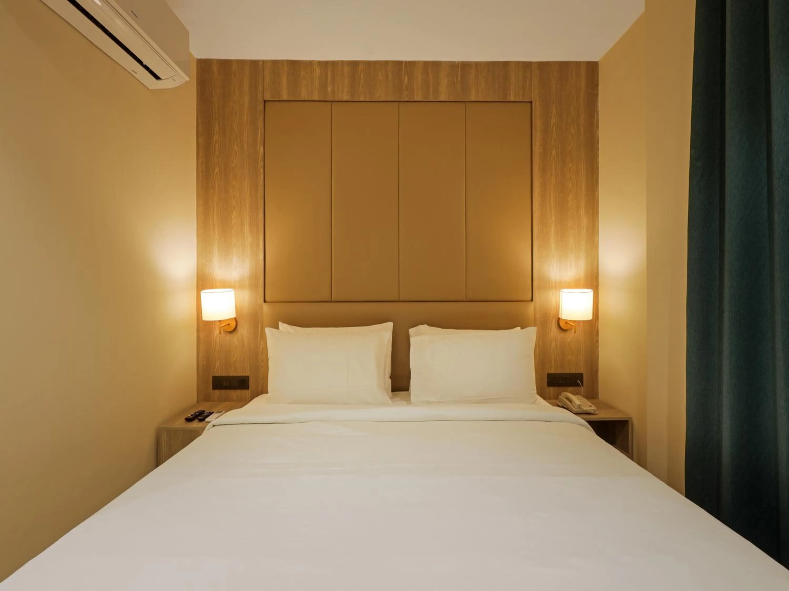 Photo of the whole room, Bed in Sunday Hotel by CheckIn Vadodara