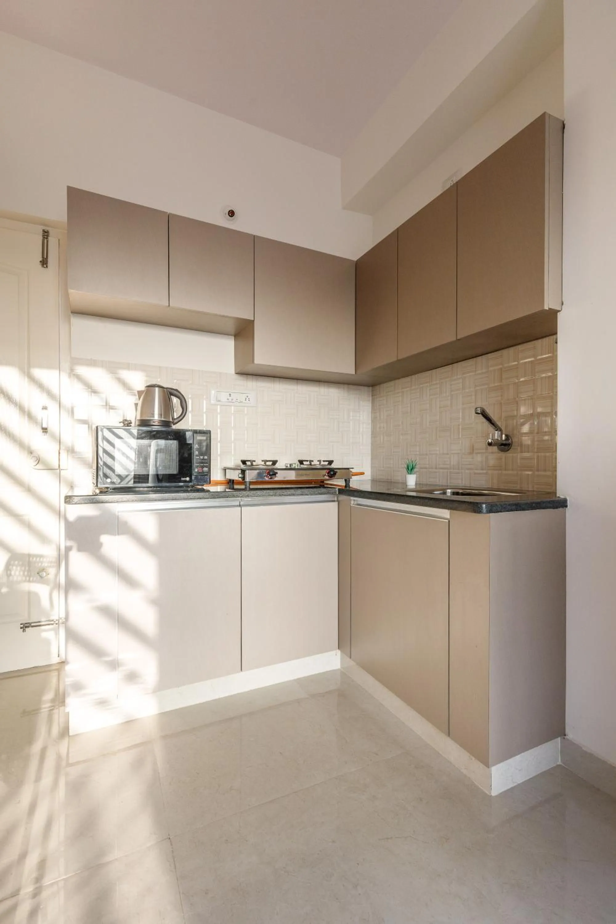 Kitchen or kitchenette in Sunrise Service Apartments