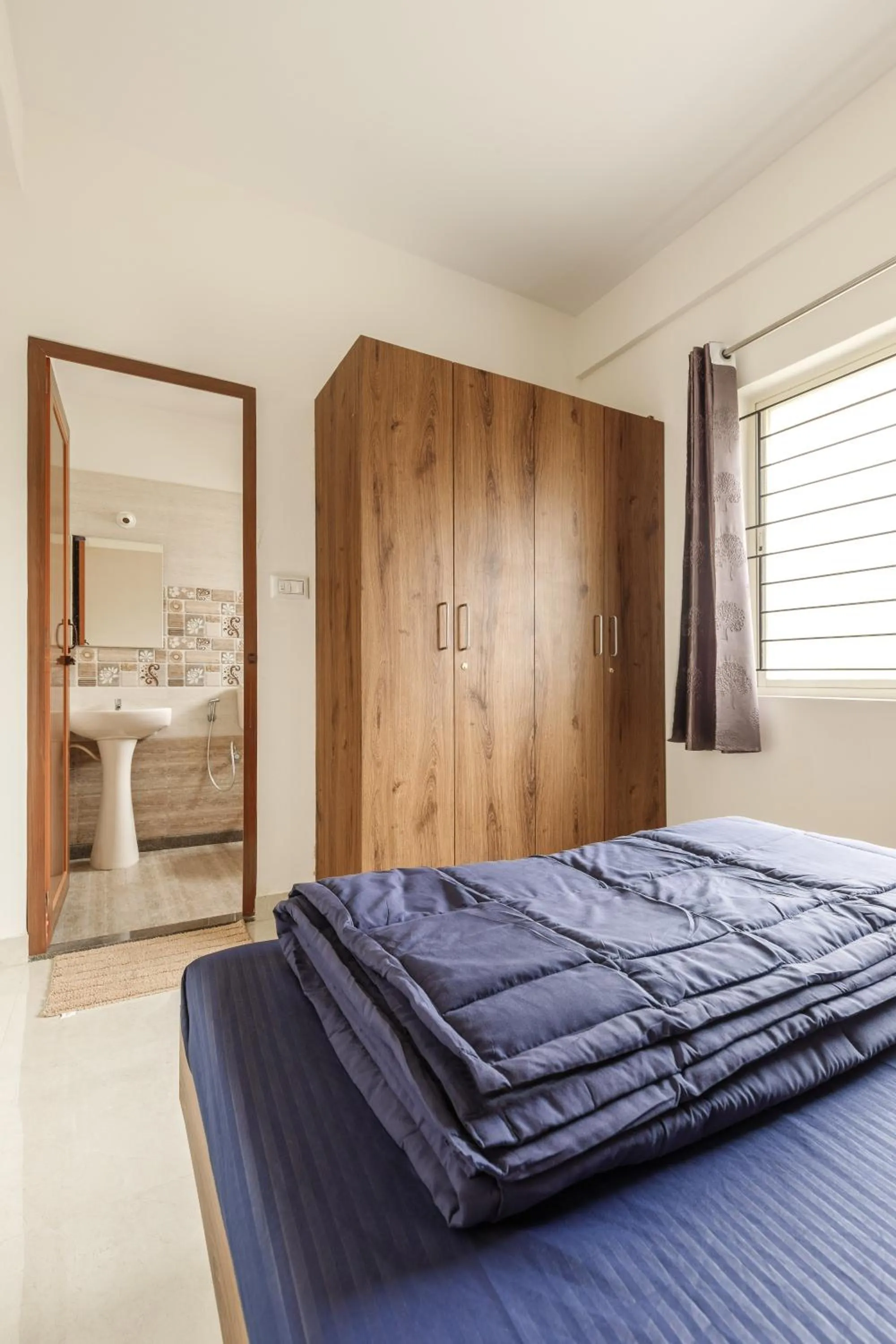 Bed in Sunrise Service Apartments